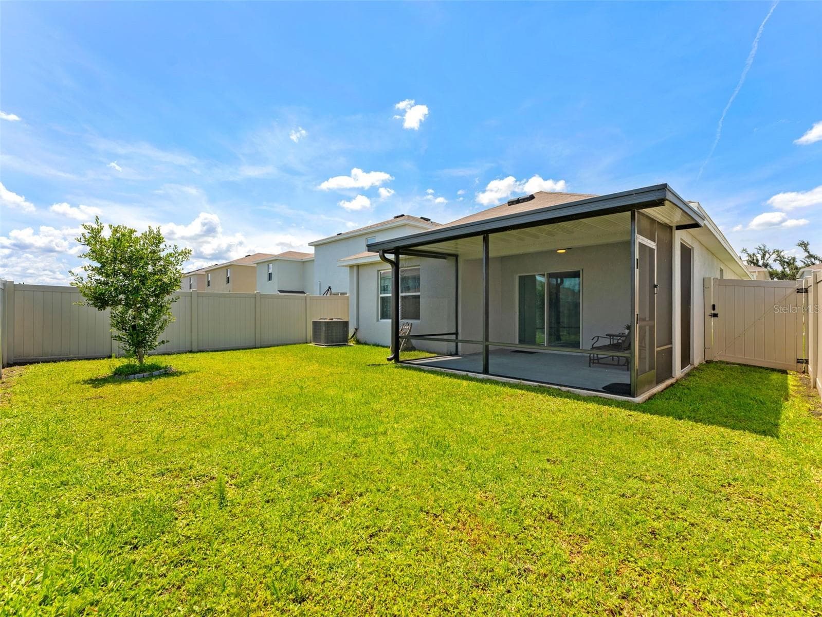 Extended patio, covered and screened in your fully fenced back yard. - 5782 HOLLINGWORTH TRL, WESLEY CHAPEL