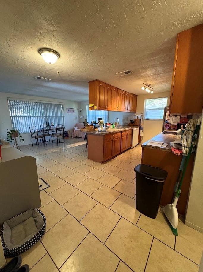 Kitchen and family room from great room - 8220 FOX HOLLOW DR, PORT RICHEY