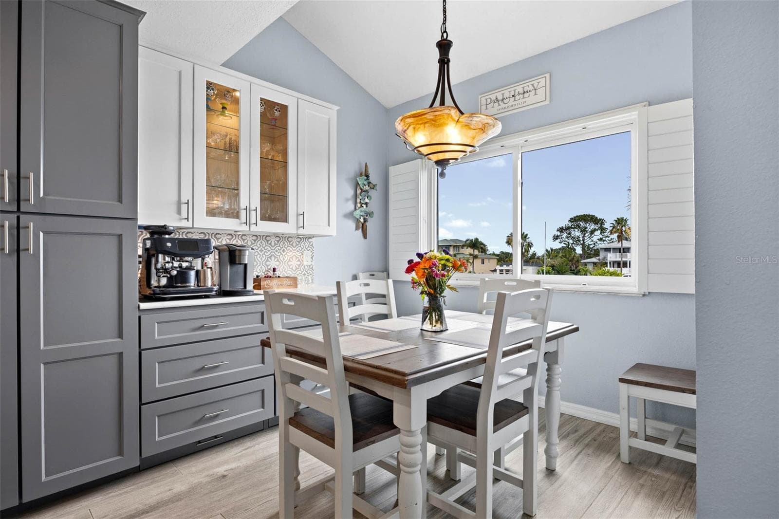 Large windows in the dining area overlooking the creek/canal. - 2395 HANOVER DR, DUNEDIN