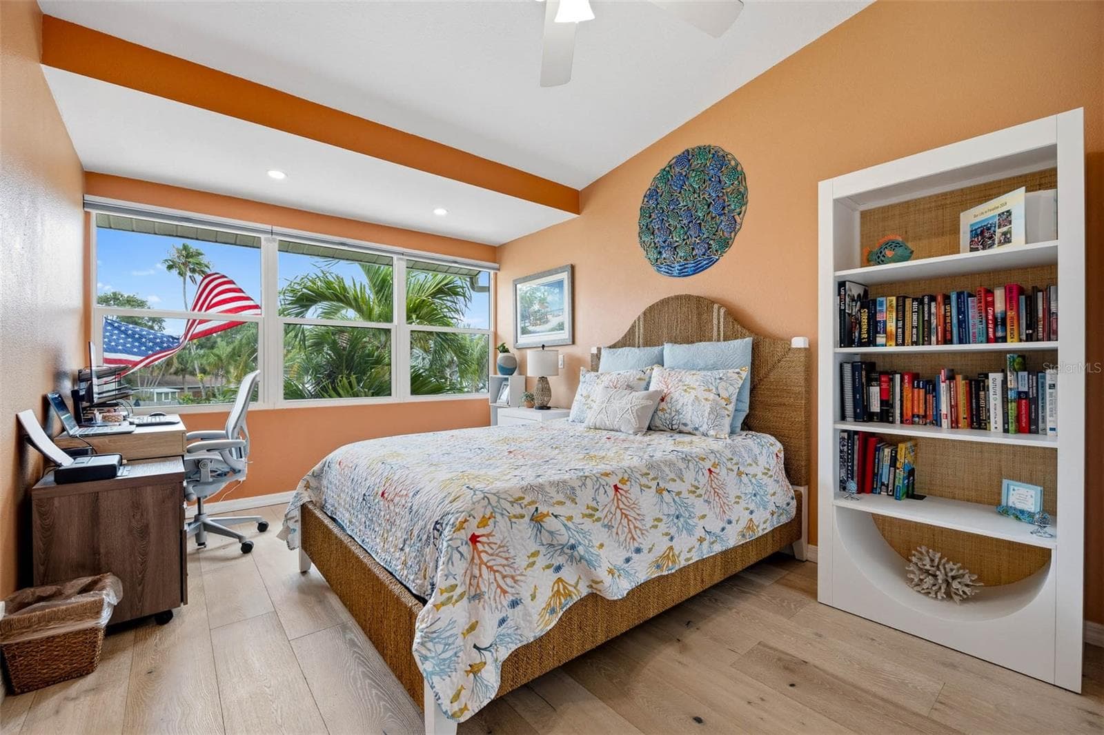 Main Floor Bedroom. Large windows allow in plenty of natural light. - 2395 HANOVER DR, DUNEDIN