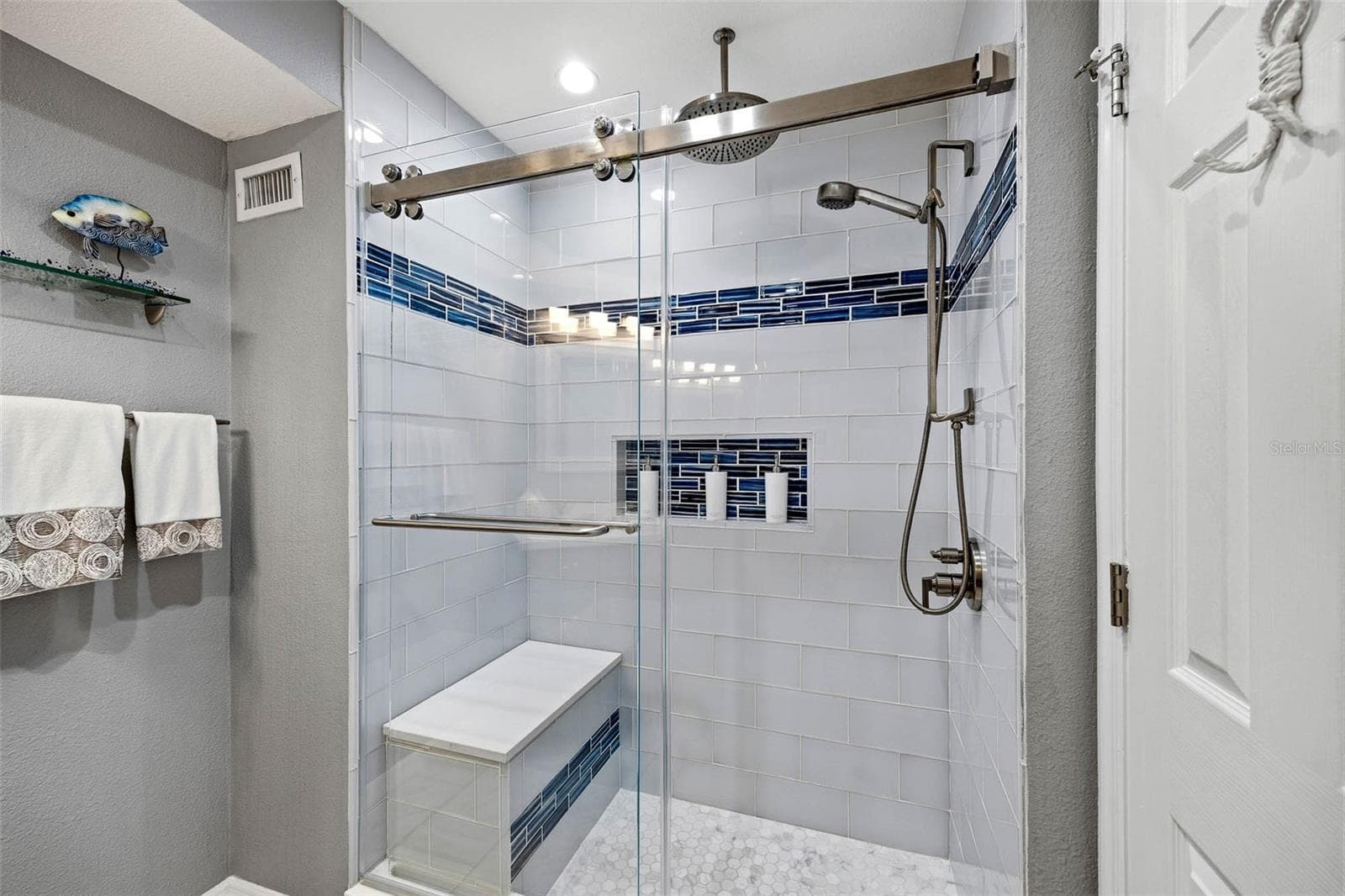 Shower in main floor full bathroom. - 2395 HANOVER DR, DUNEDIN
