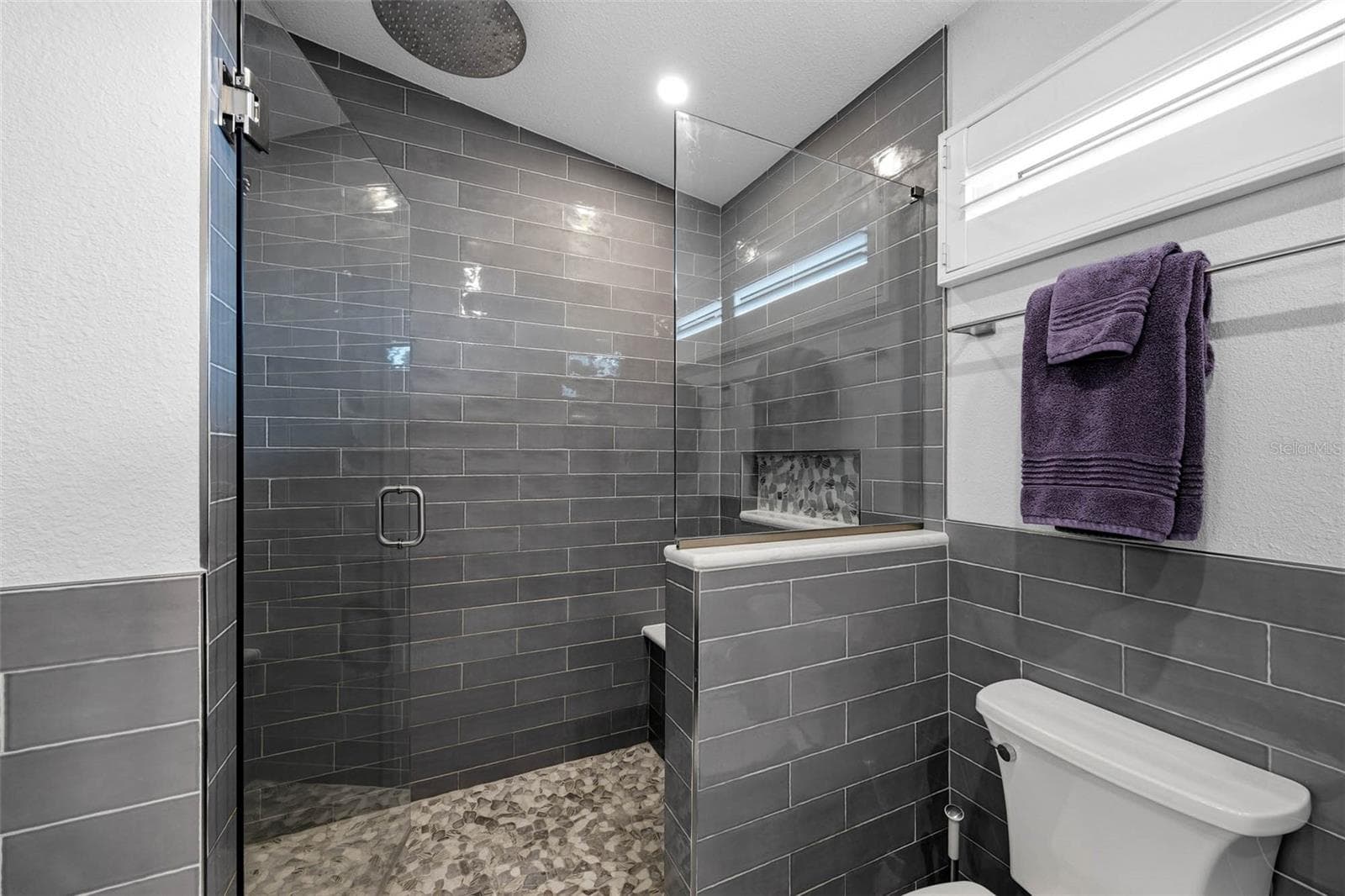 Beautiful tiled shower with rainfall shower head - 2395 HANOVER DR, DUNEDIN