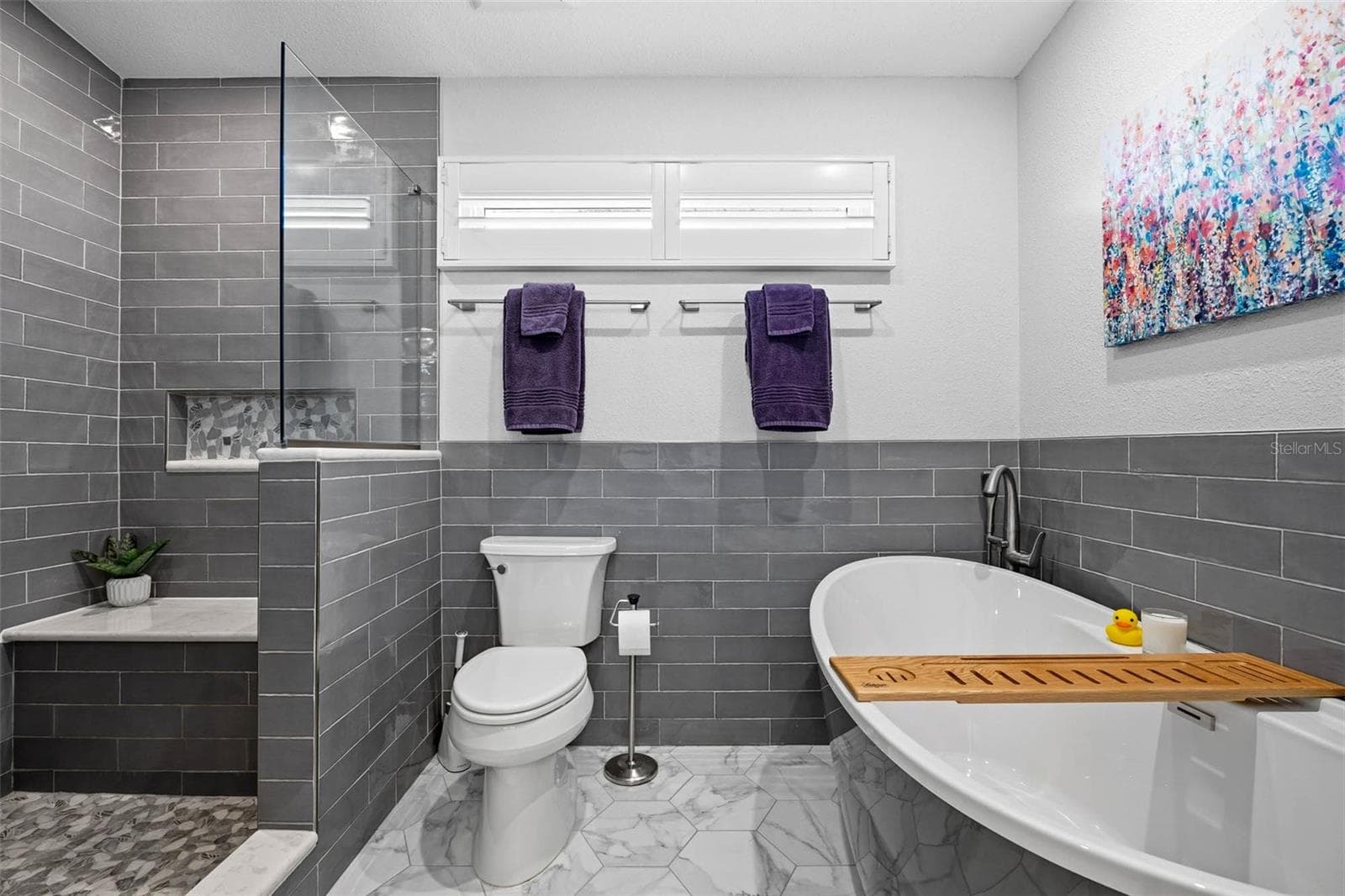 Relaxing soaker tub in Primary Bathroom with hot water provided by the On Demand Water Heater that supports 8.5 GPM so you can be soaking in minutes! - 2395 HANOVER DR, DUNEDIN