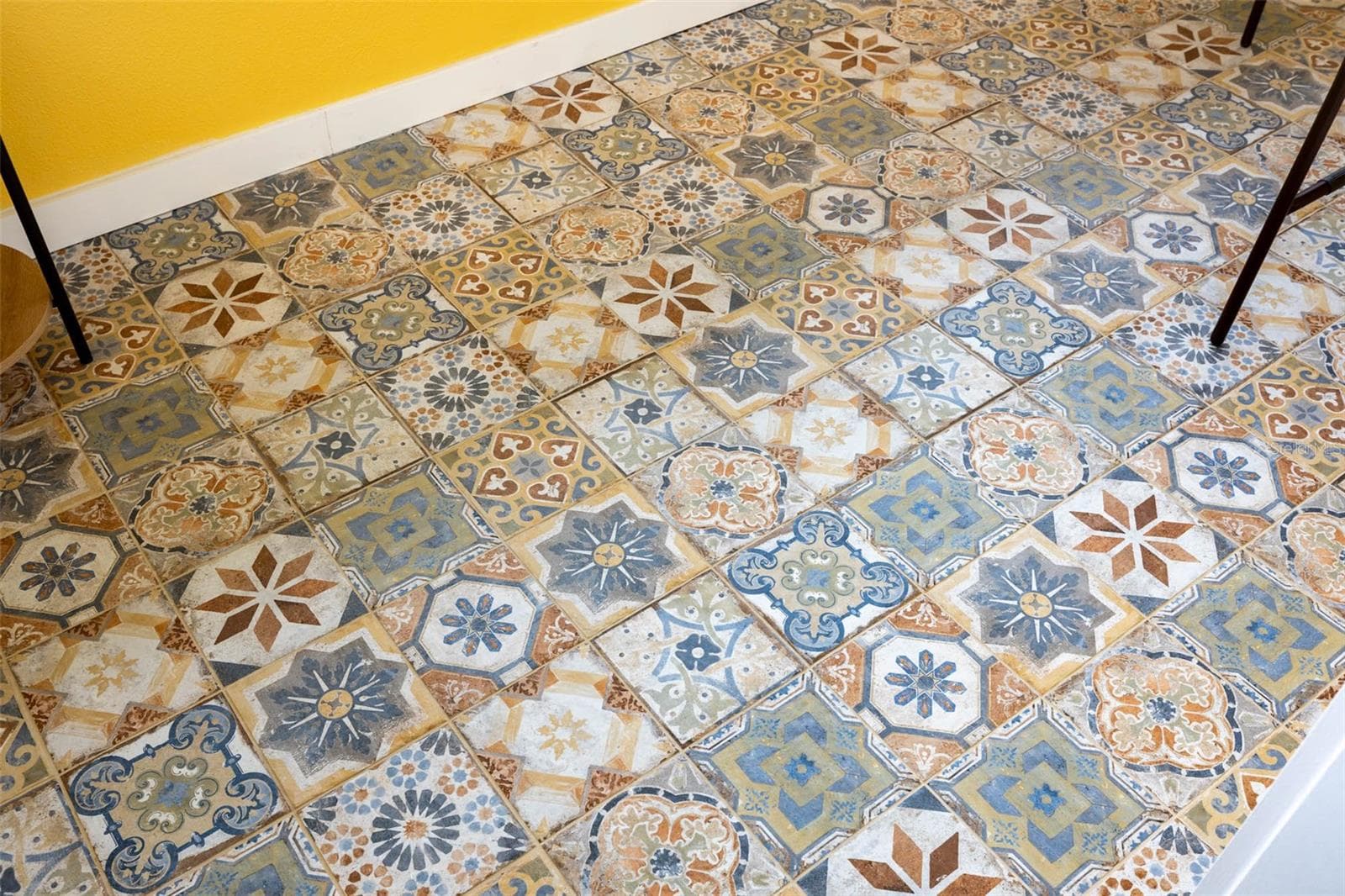 Detail view of custom tile floor in 3rd floor Balcony room. - 2395 HANOVER DR, DUNEDIN