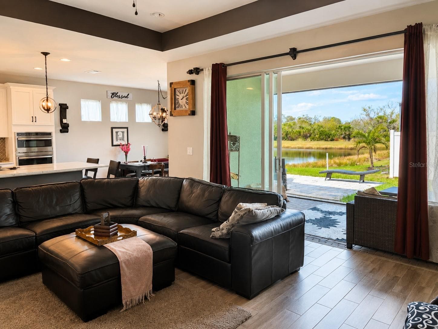 Stackable sliding doors to covered patio and Screened in Lanai - 12571 NIGHT VIEW DR, SARASOTA