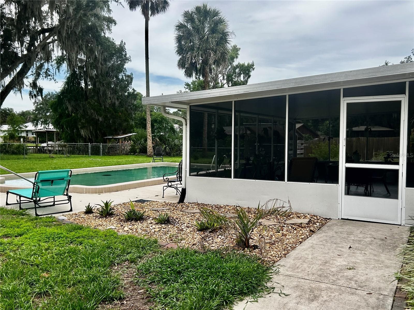 side gates on both side of the house for easy entry to pool or add'l parking - 2950 N SHELL RD, DELAND