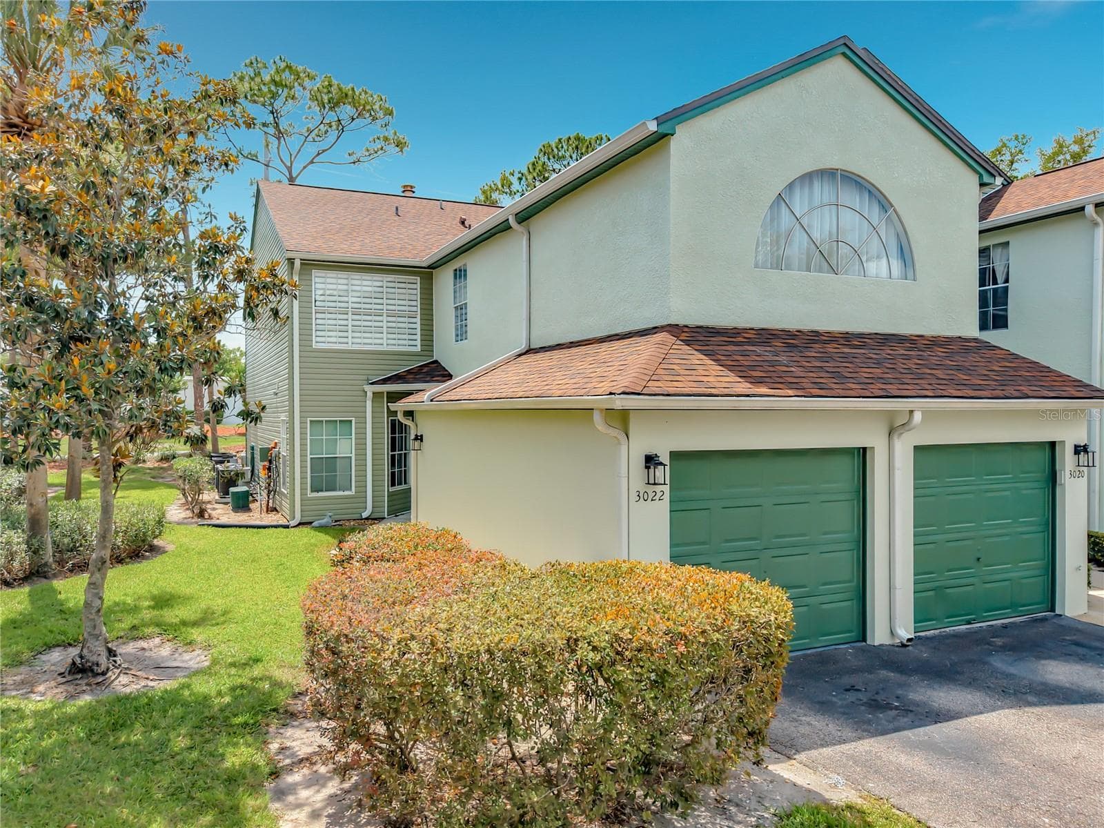 Condo entry is far back, while left side garage is the unit's garage. - 3022 COTTAGE GROVE CT #1807, ORLANDO
