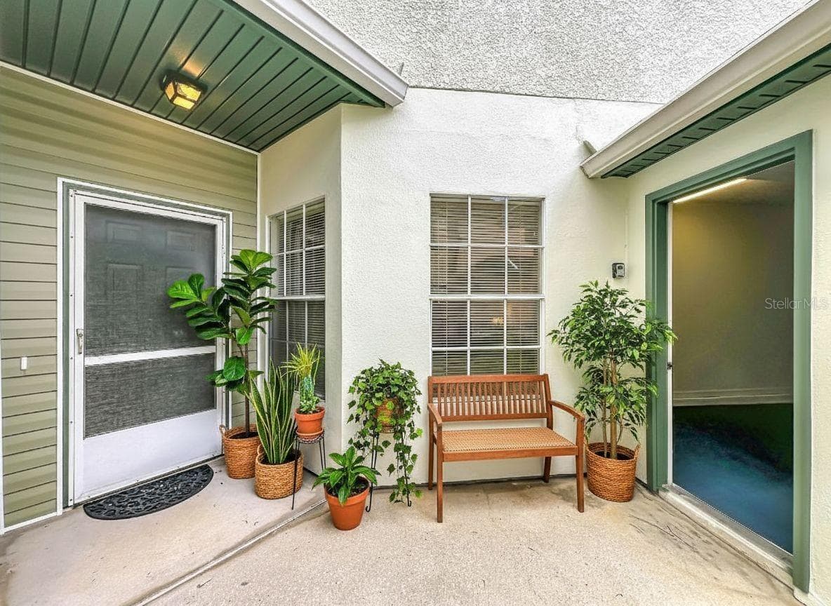 Courtyard view with garage door opened. - 3022 COTTAGE GROVE CT #1807, ORLANDO
