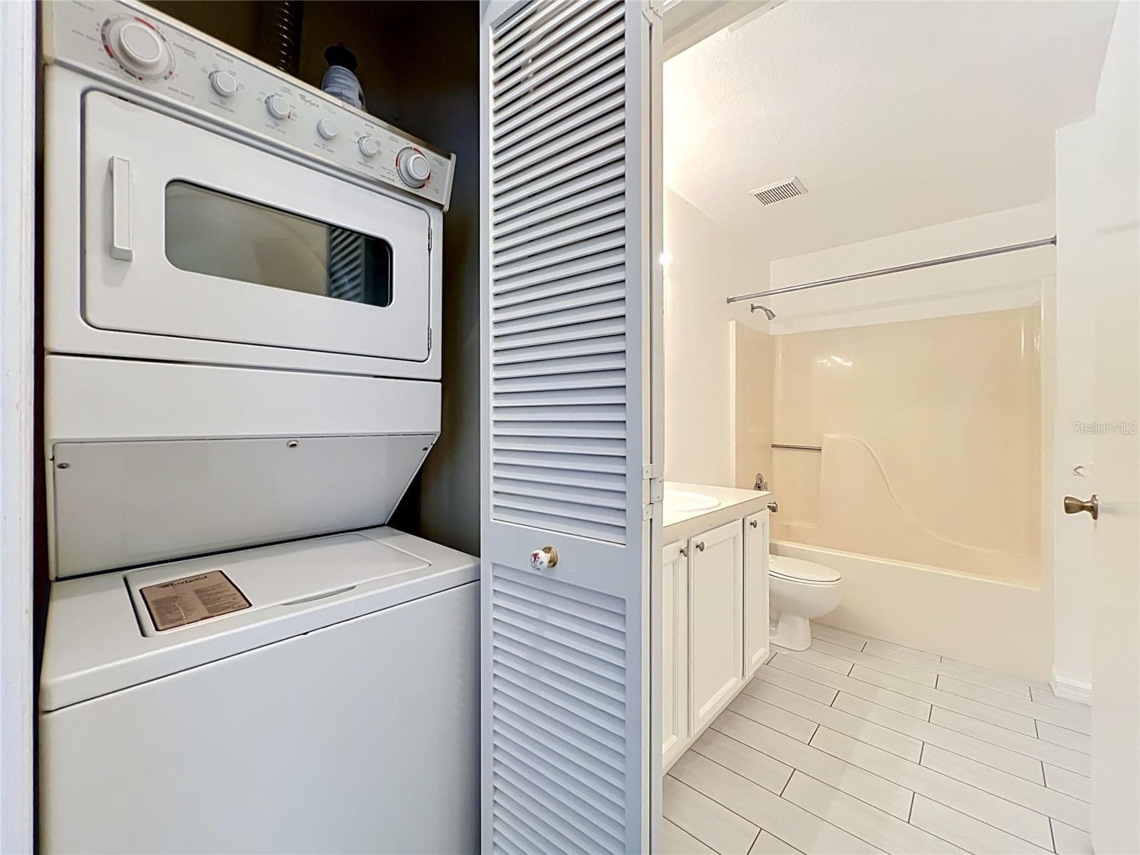 Washer and Dryer closet.  Appliances stay - 3022 COTTAGE GROVE CT #1807, ORLANDO