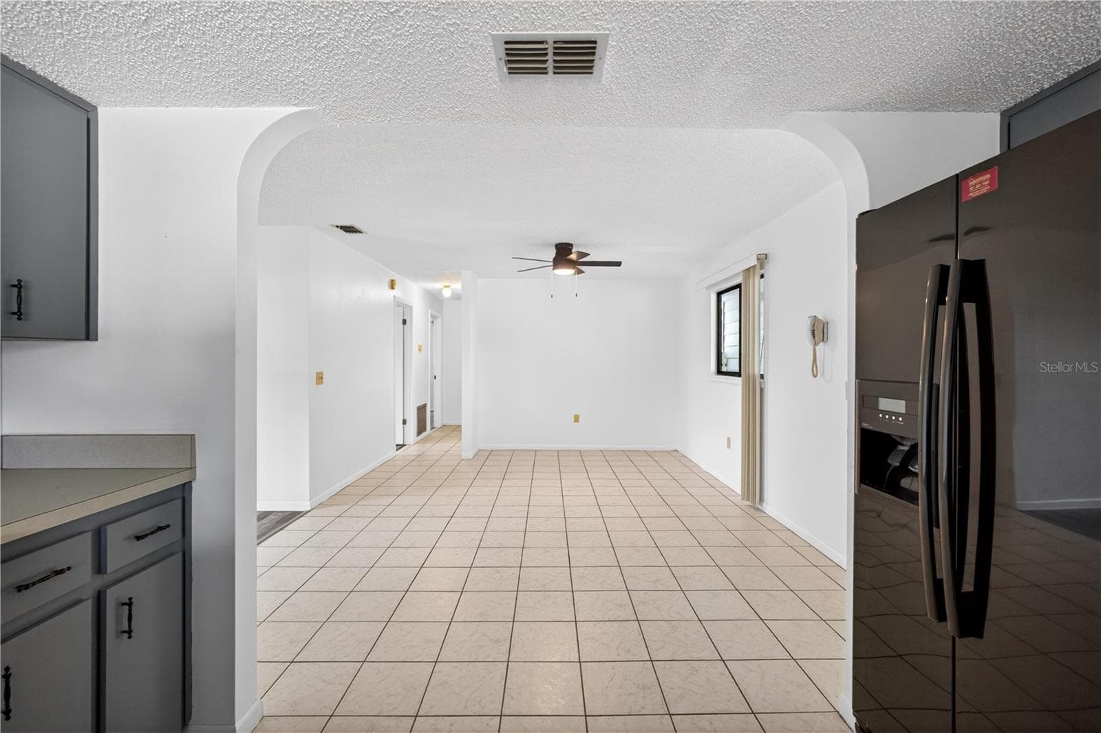View of Dining Room from Kitchen - 8972 SW 103RD LN, OCALA