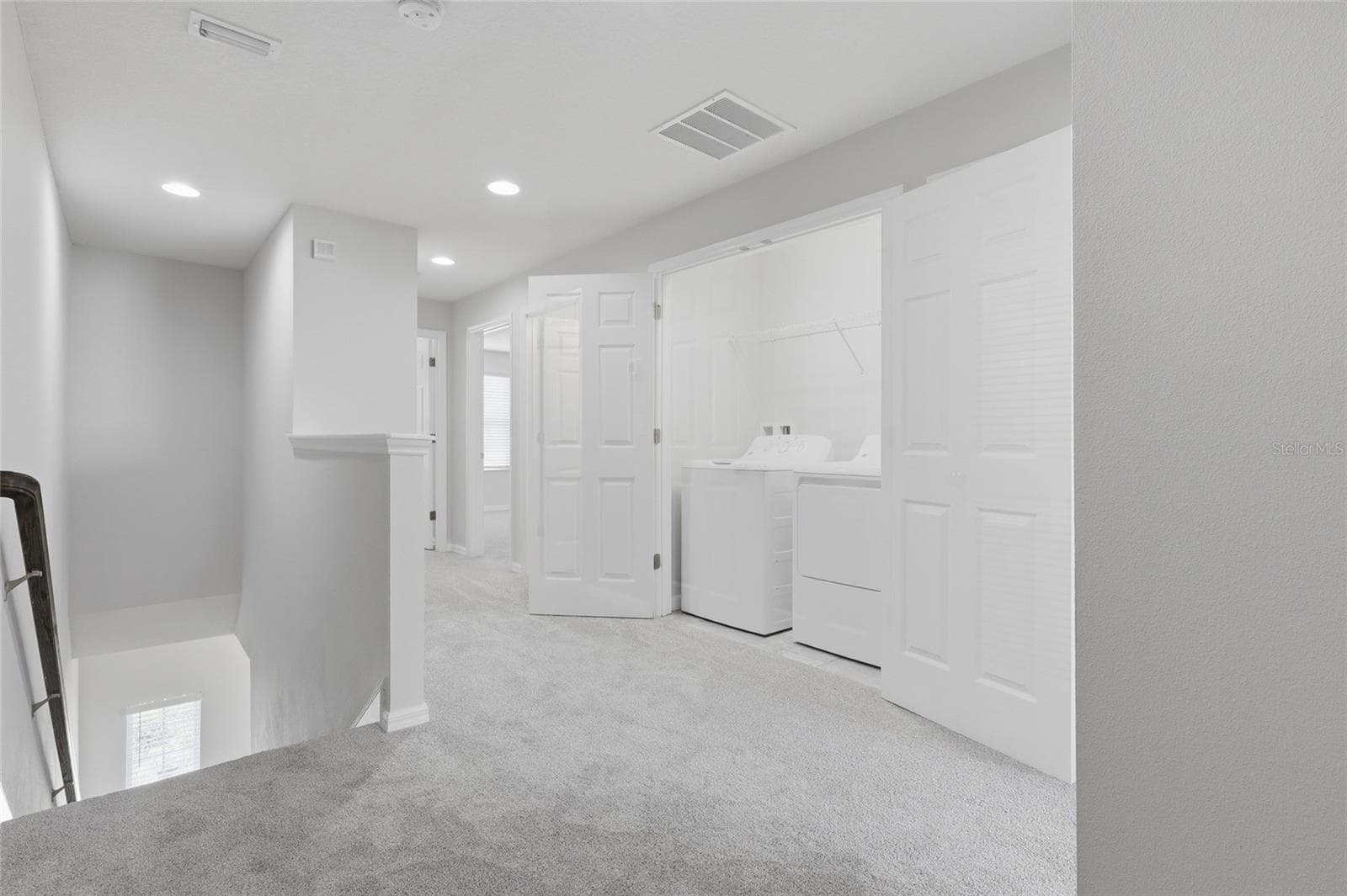 Upstairs landing offering access to all secondary bedrooms and the primary suite - 7005 GRAND ELM DR, RIVERVIEW