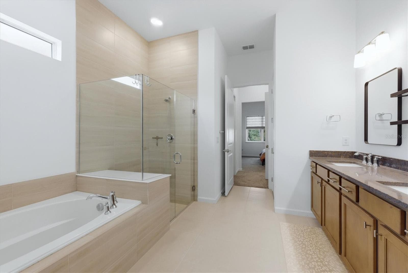 Primary bath with tub and separate shower - 29248 CORAL HARBOUR DR, ENGLEWOOD