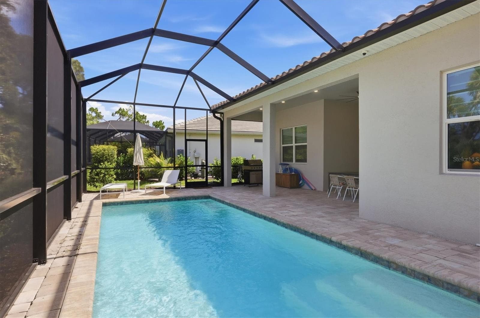Saltwater pool with extended lanai - 29248 CORAL HARBOUR DR, ENGLEWOOD