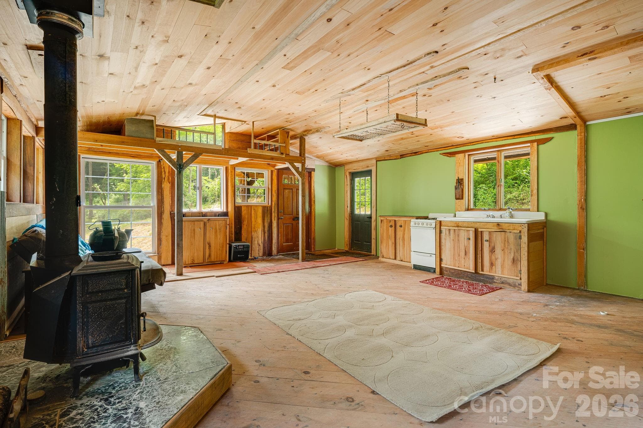 Spacious open floor plan with woodburning stove - 224 Allen Drive, Marshall