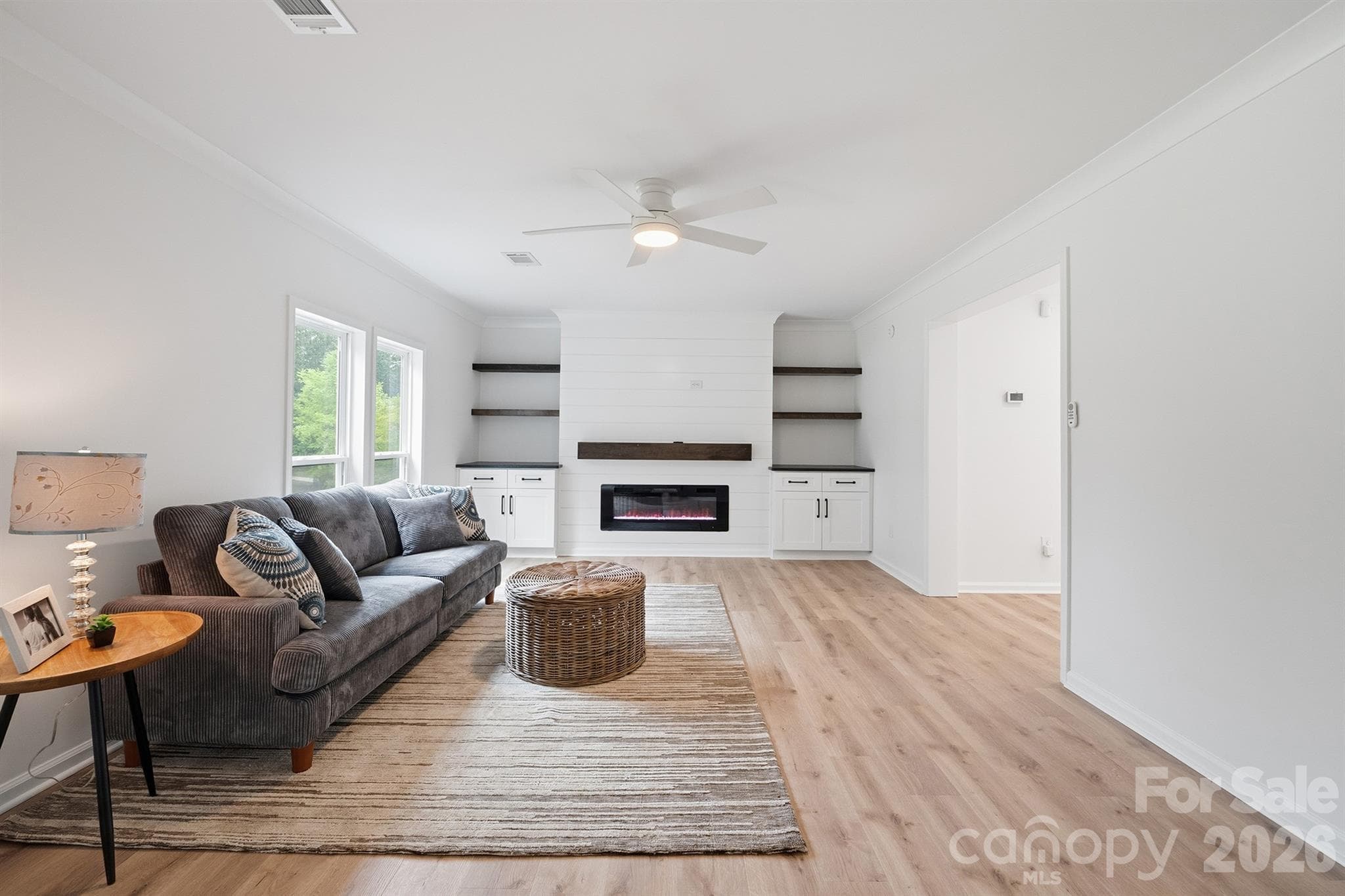 Spacious living room with feature wall - 7553 Katherine Drive, Denver