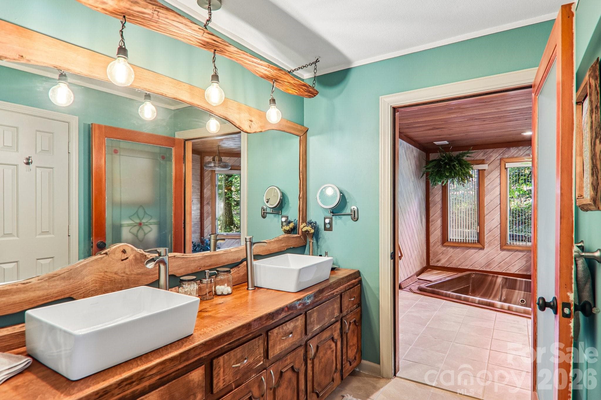 Bathroom in primary bedroom, mountain style details, spa entrance. - Hendersonville