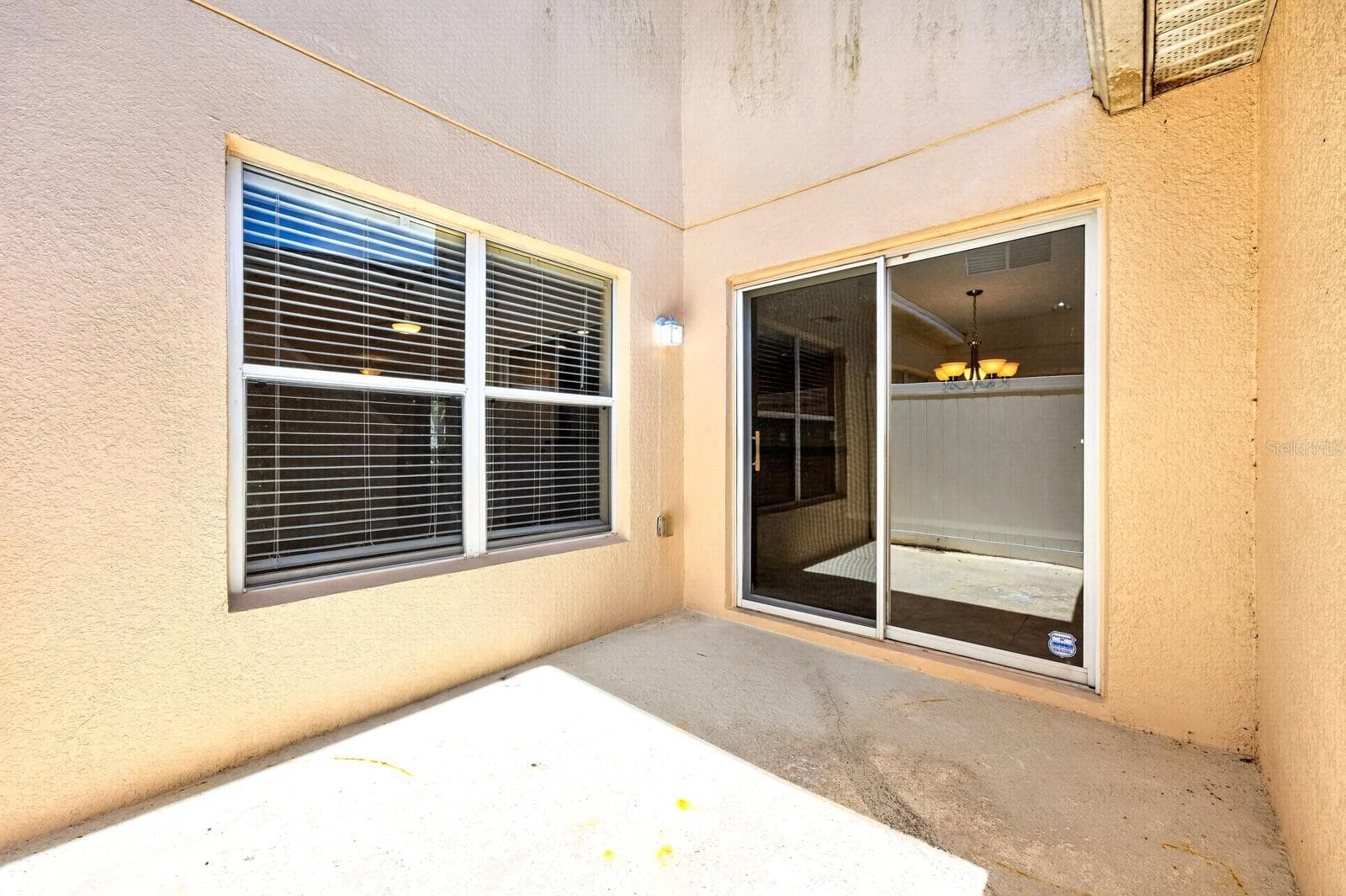Sliding glass doors lead to the patio, creating an effortless INDOOR-OUTDOOR CONNECTION. - 2564 ABEY BLANCO DR, ORLANDO