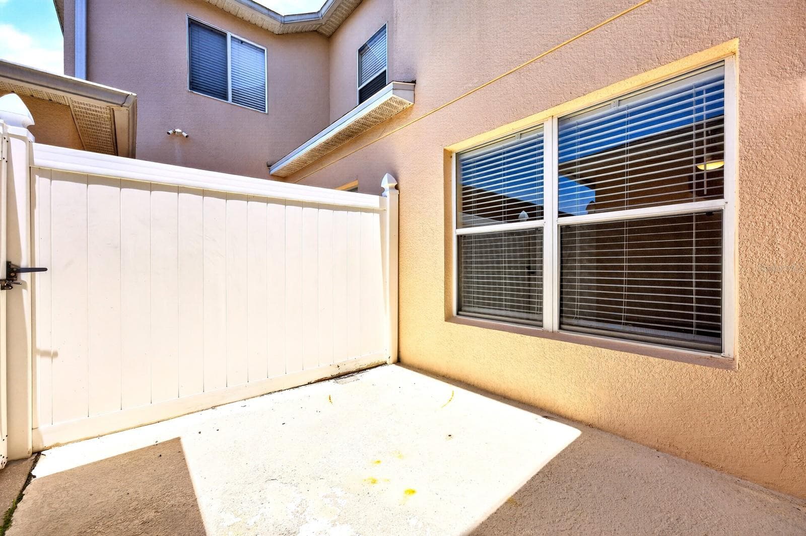 Sliding glass doors lead to the patio, creating an effortless INDOOR-OUTDOOR CONNECTION. - 2564 ABEY BLANCO DR, ORLANDO