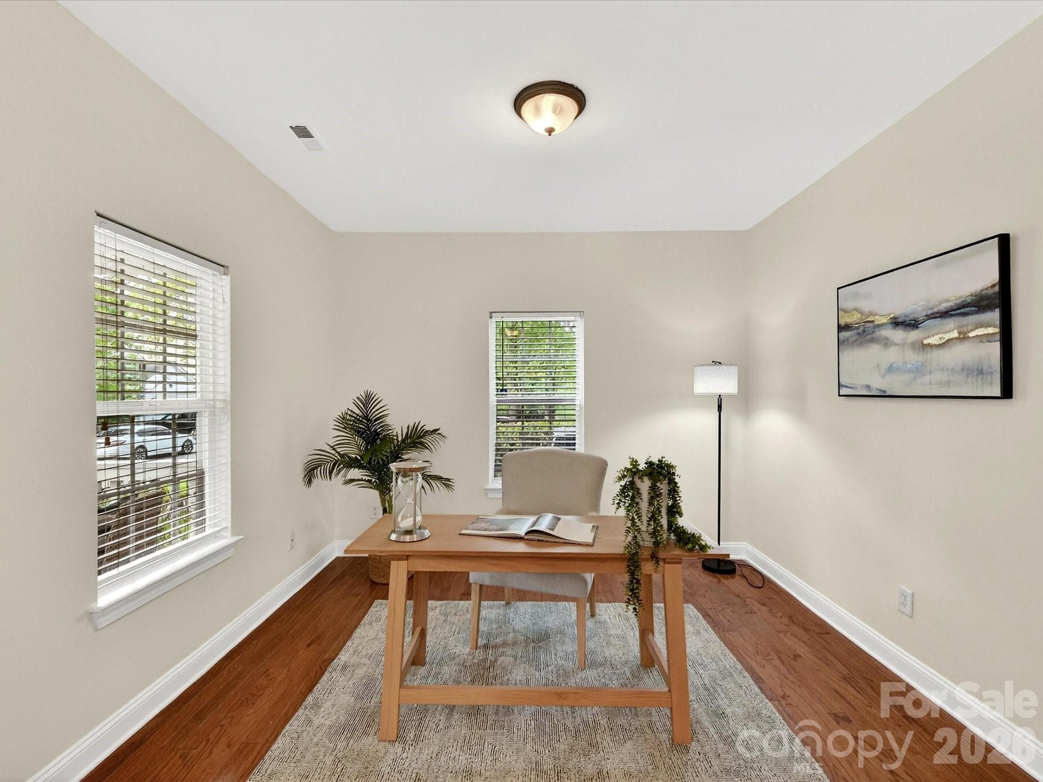 Versatile office or flex space features hardwood flooring, abundant natural light, and ample room for a home office, study, playroom, or additional living area. - Cornelius