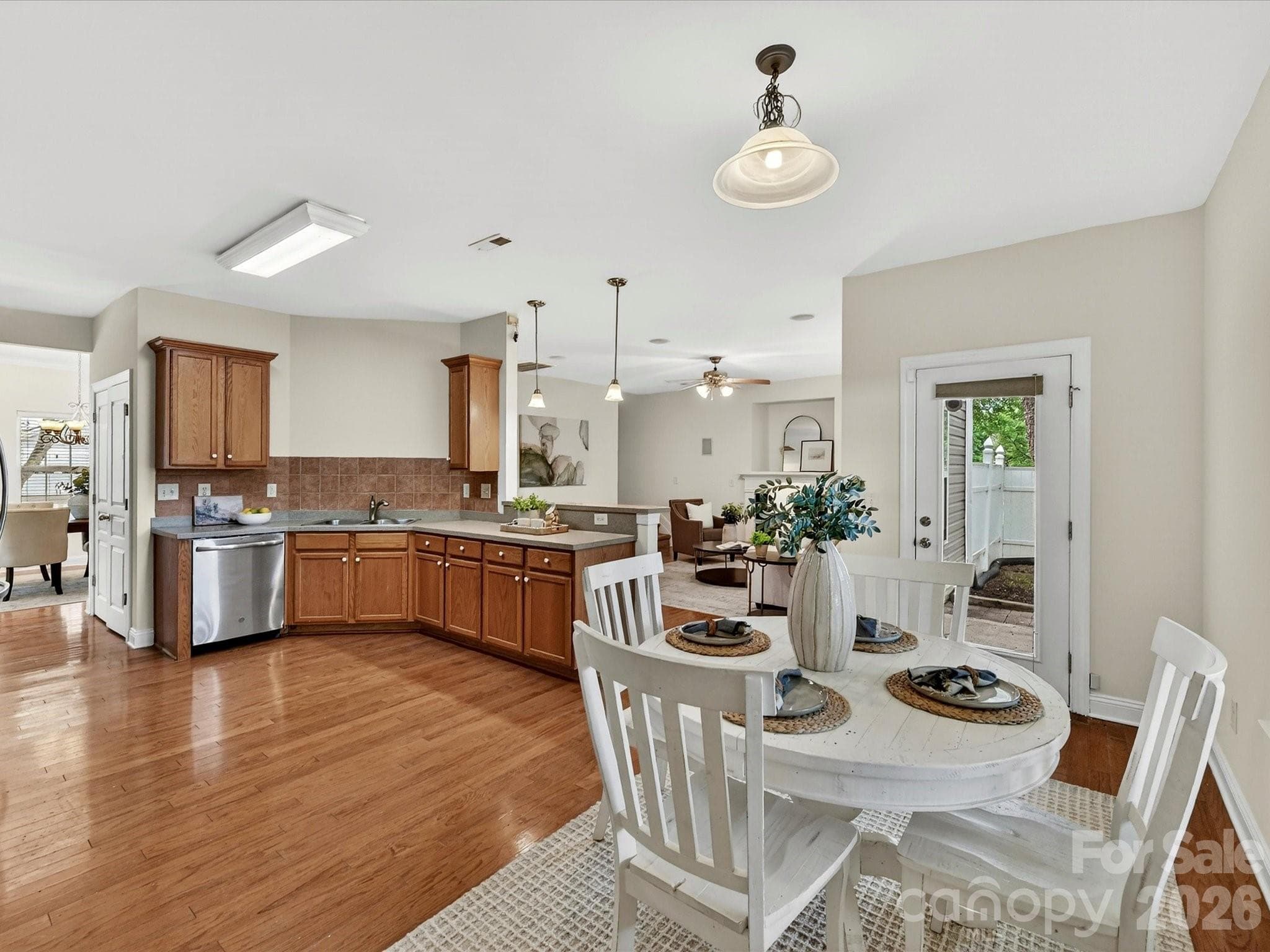 Sunny breakfast nook overlooks the backyard and flows effortlessly into the well-appointed kitchen, creating an inviting space for casual dining and everyday gathering. - Cornelius