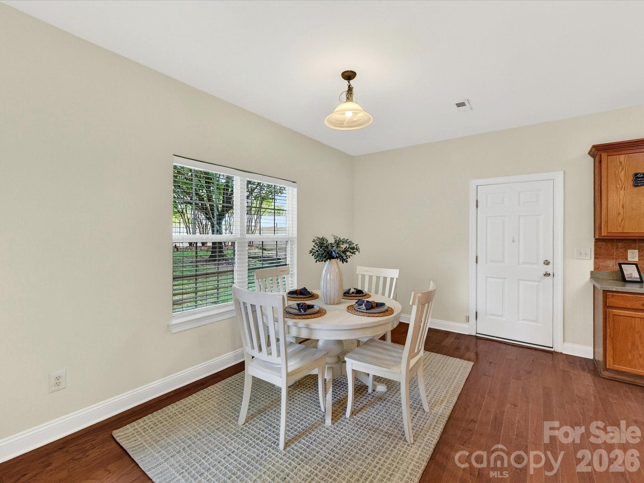 Sunny breakfast nook overlooks the backyard and flows effortlessly into the well-appointed kitchen, creating an inviting space for casual dining and everyday gathering. - Cornelius