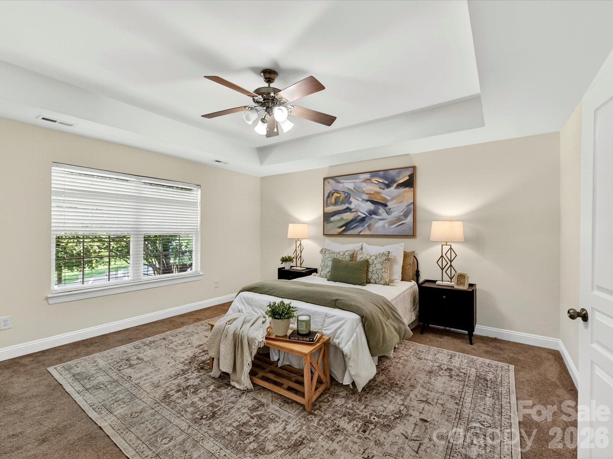 Expansive primary suite on upper level features a tray ceiling, abundant natural light, and ample room for a sitting area, creating a comfortable and private retreat. - Cornelius