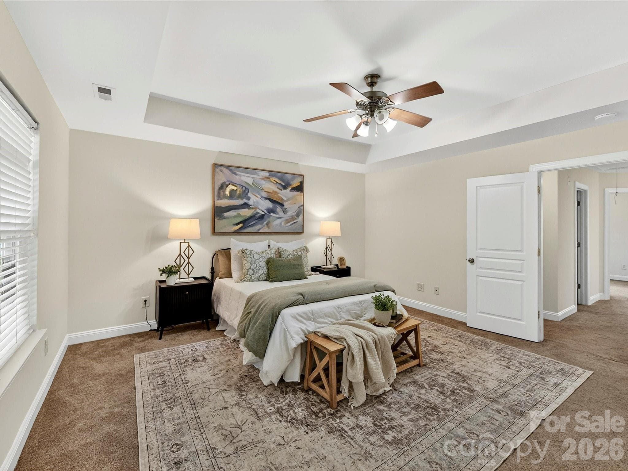 Expansive primary suite on upper level features a tray ceiling, abundant natural light, and ample room for a sitting area, creating a comfortable and private retreat. - Cornelius