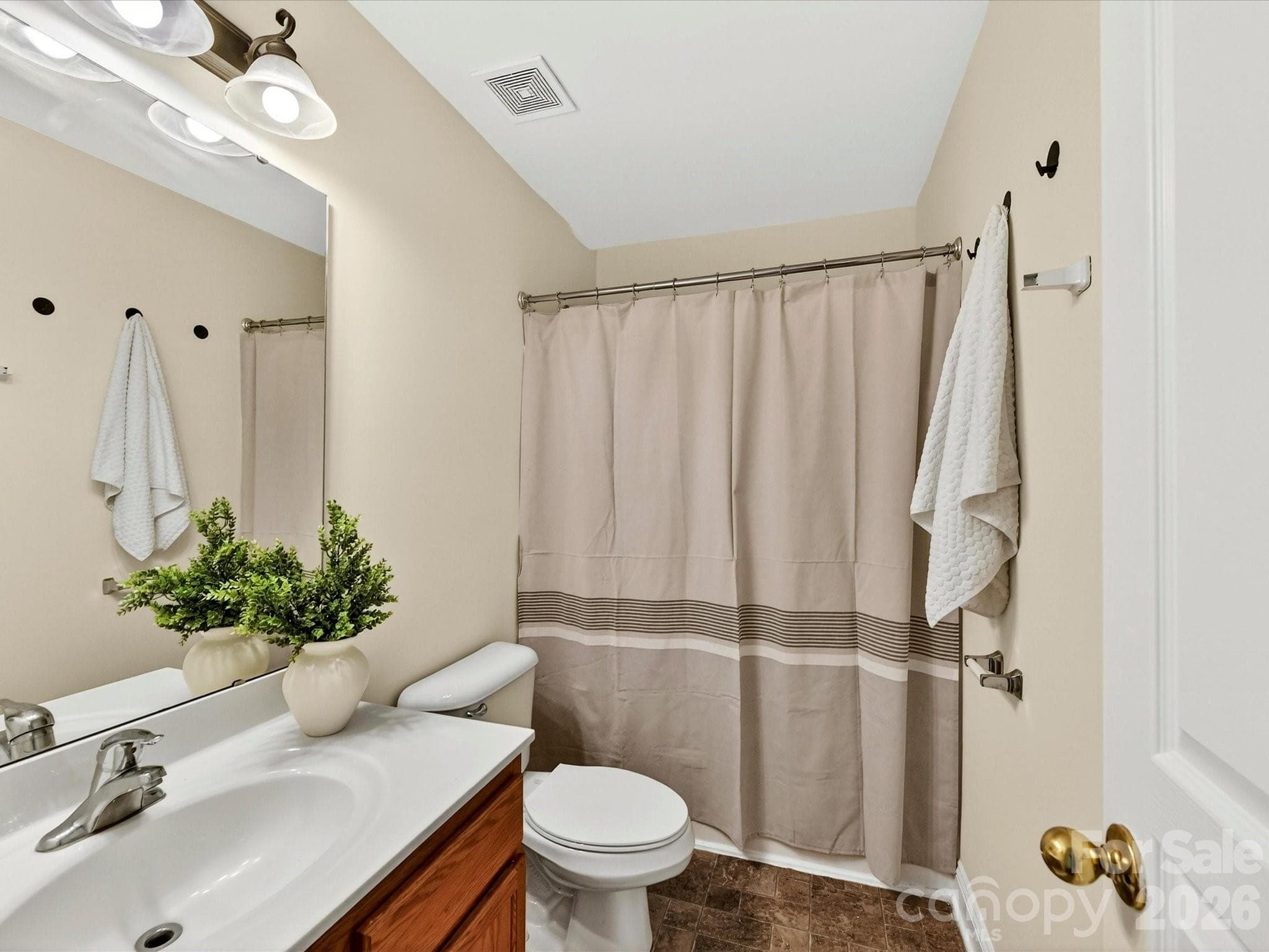 Well-appointed secondary full bathroom features a vanity with ample counter space and a tub/shower combination, providing convenience and functionality for family and guests. - Cornelius