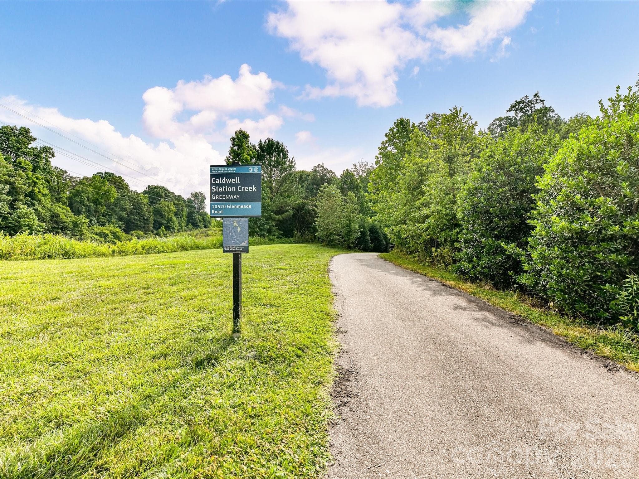 Enjoy convenient access to the Caldwell Station Creek Greenway, offering a scenic paved walking path surrounded by natural beauty for outdoor recreation and daily exercise. - Cornelius