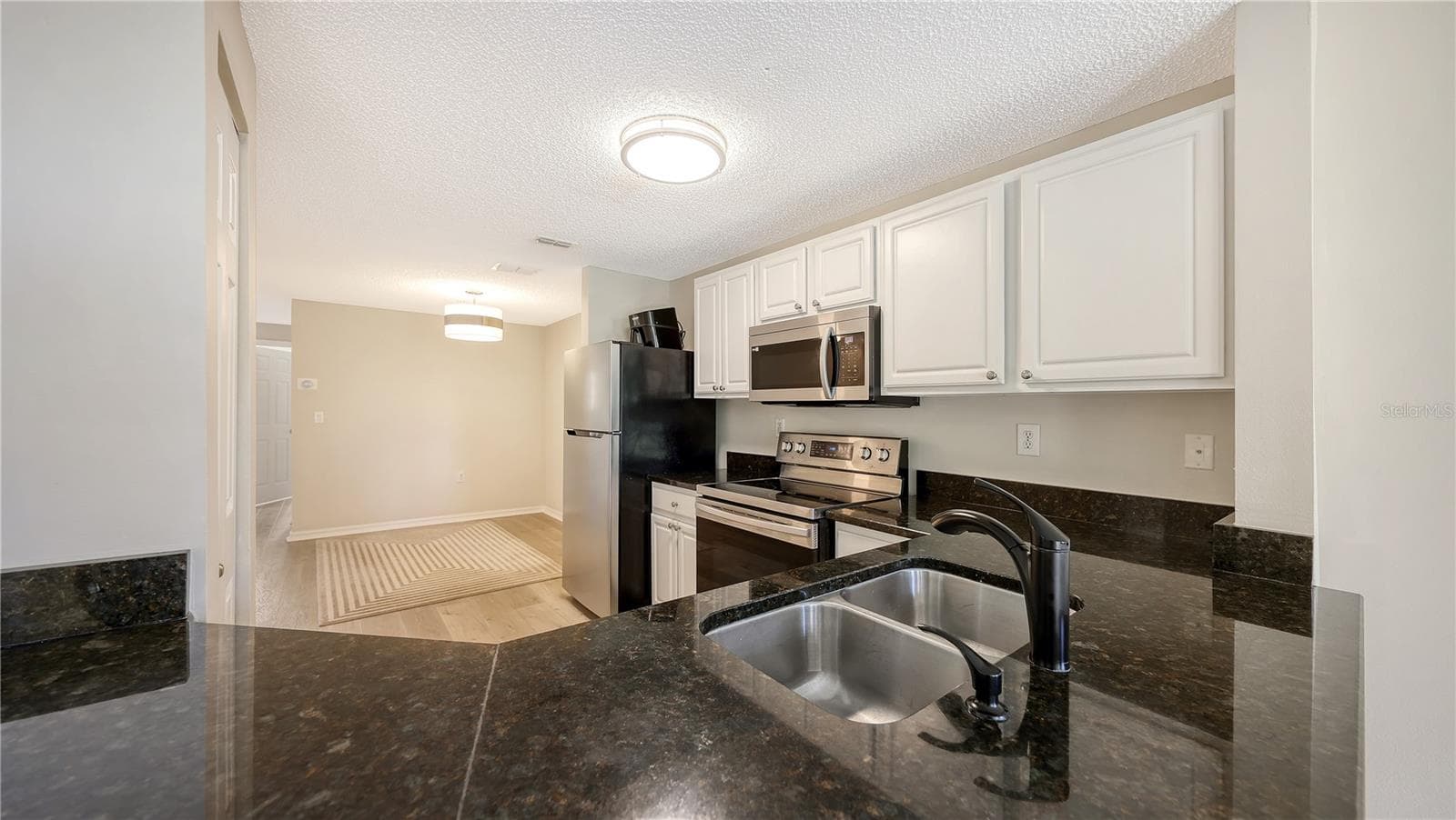 Newer stainless steel Appliances. - 5551 BENTGRASS DR #11-117, SARASOTA