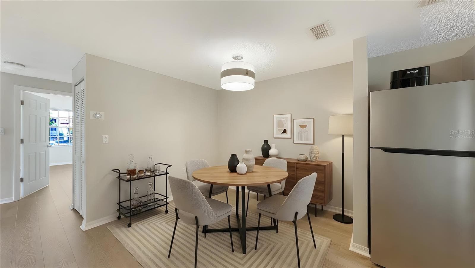 Virtually staged. Dining room - 5551 BENTGRASS DR #11-117, SARASOTA
