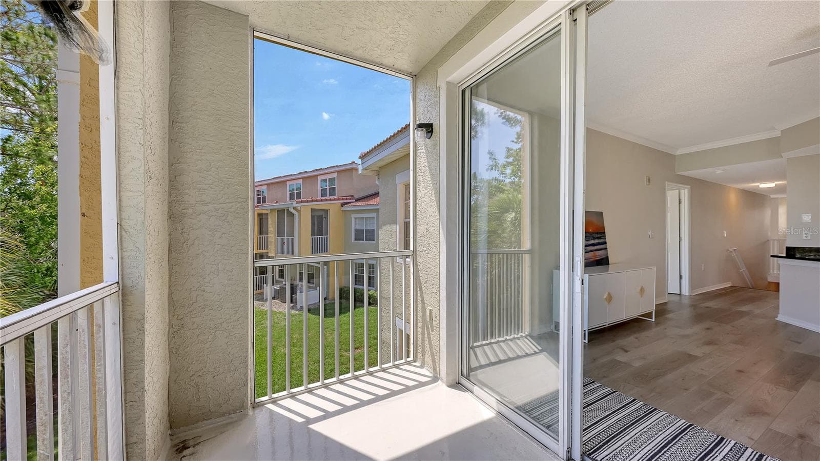 Sliding glass doors open up to spacious screened lanai. - 5551 BENTGRASS DR #11-117, SARASOTA