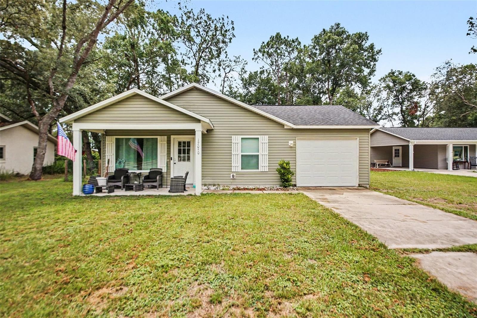 Garage for boat parking, extra storage, or the traditional one car garage with plenty of space for extra parking. Washer & Dryer hookup are in the garage. - 17050 SE 60TH ST, OCKLAWAHA