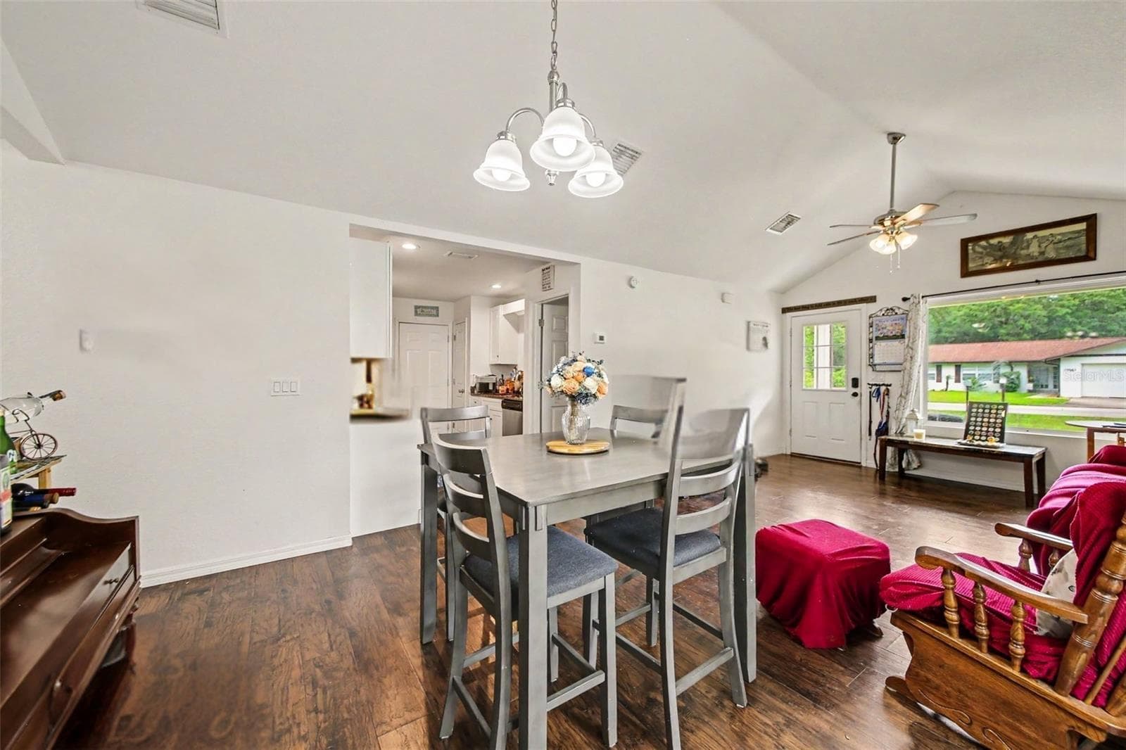 Galley Way kitchen off the living room connects to the garage for easy grocery transport. This kitchen offers a pantry and an appropriate amount of cabinet space. - 17050 SE 60TH ST, OCKLAWAHA