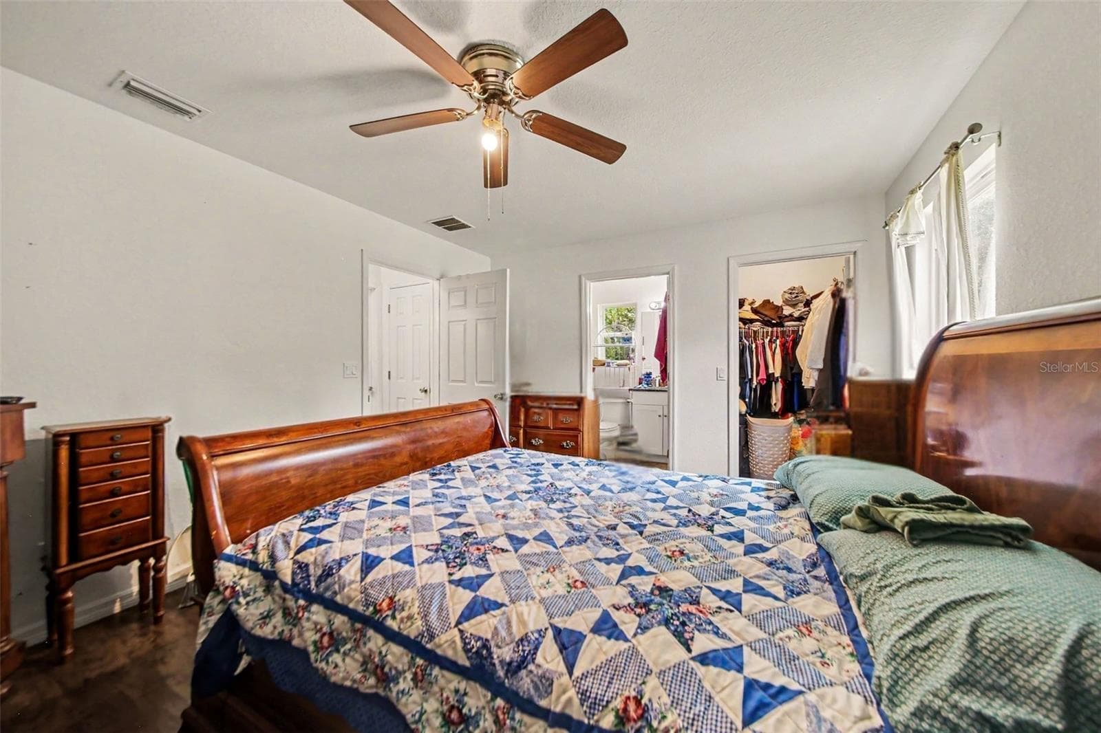 Primary Bedroom with walk-in closet, shower bathroom en suite, and natural light sweeping throughout. - 17050 SE 60TH ST, OCKLAWAHA