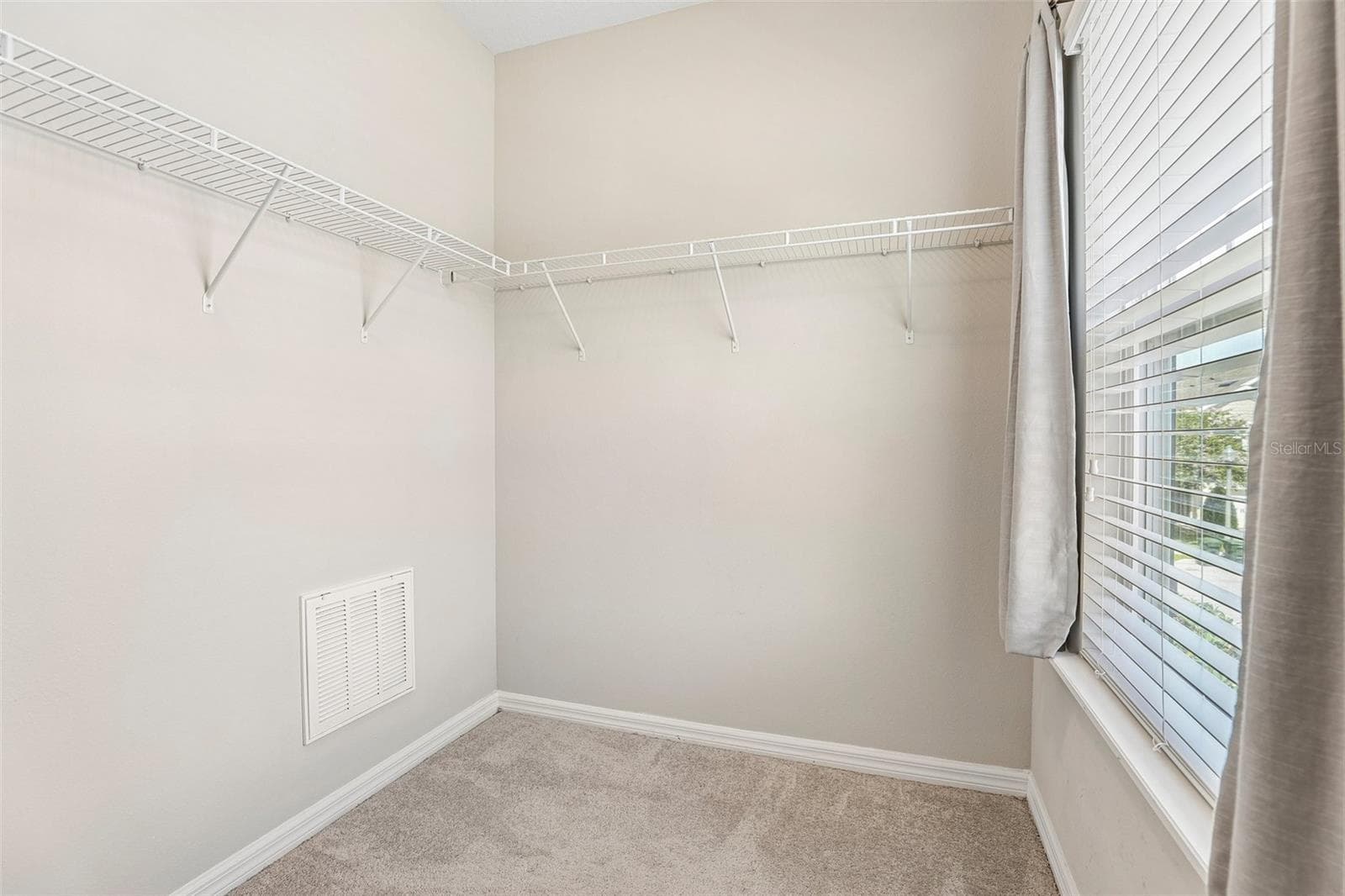 Primary suite walk-in closet. - 198 MITCHELL CREEK WAY, OVIEDO