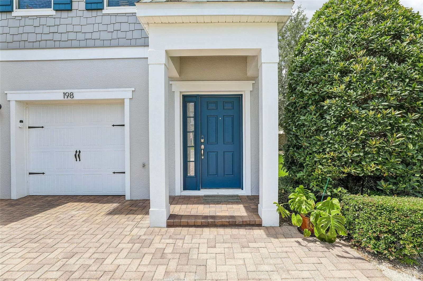 1-car garage and covered front entry. - 198 MITCHELL CREEK WAY, OVIEDO
