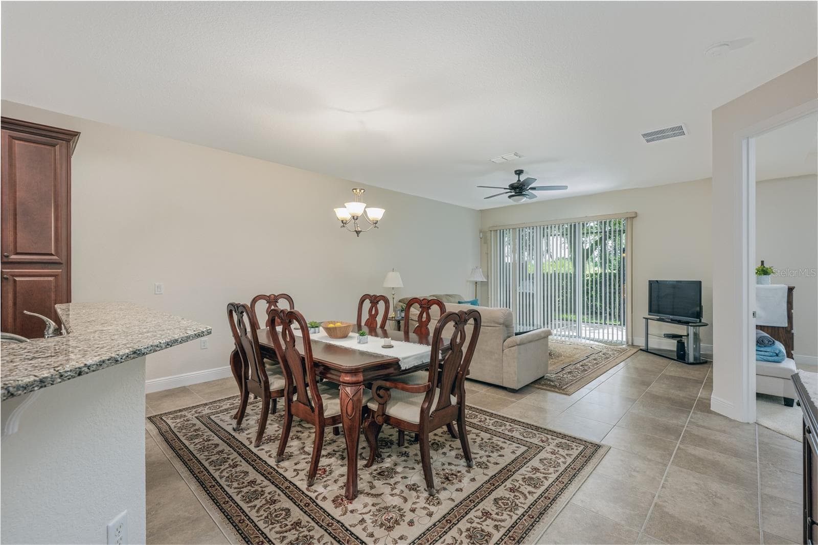 Dining room and living room view - 10751 BELFRY CIR, ORLANDO