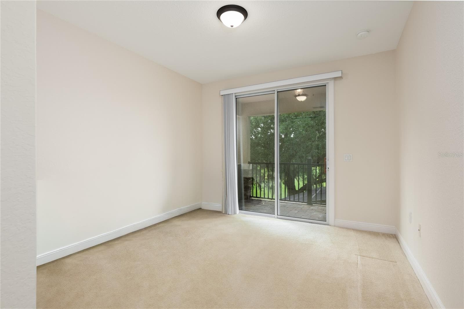 Second bedroom leading to balcony - 10751 BELFRY CIR, ORLANDO