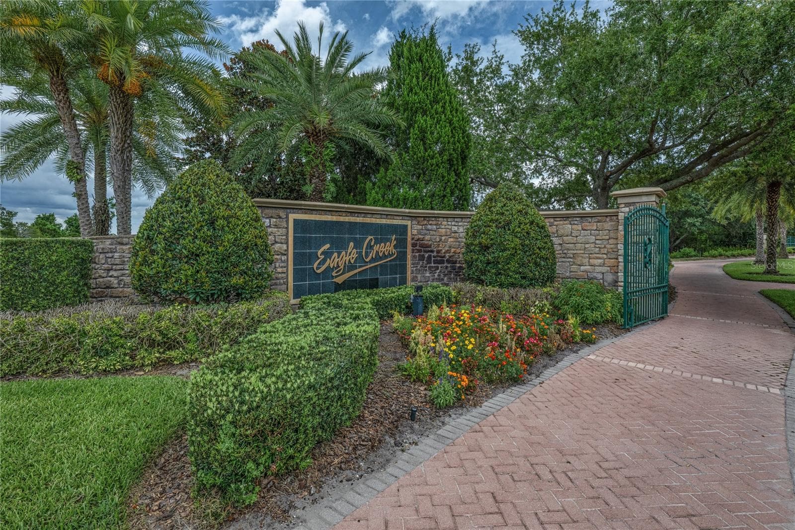 Entrance to Eagle Creek gated community - 10751 BELFRY CIR, ORLANDO