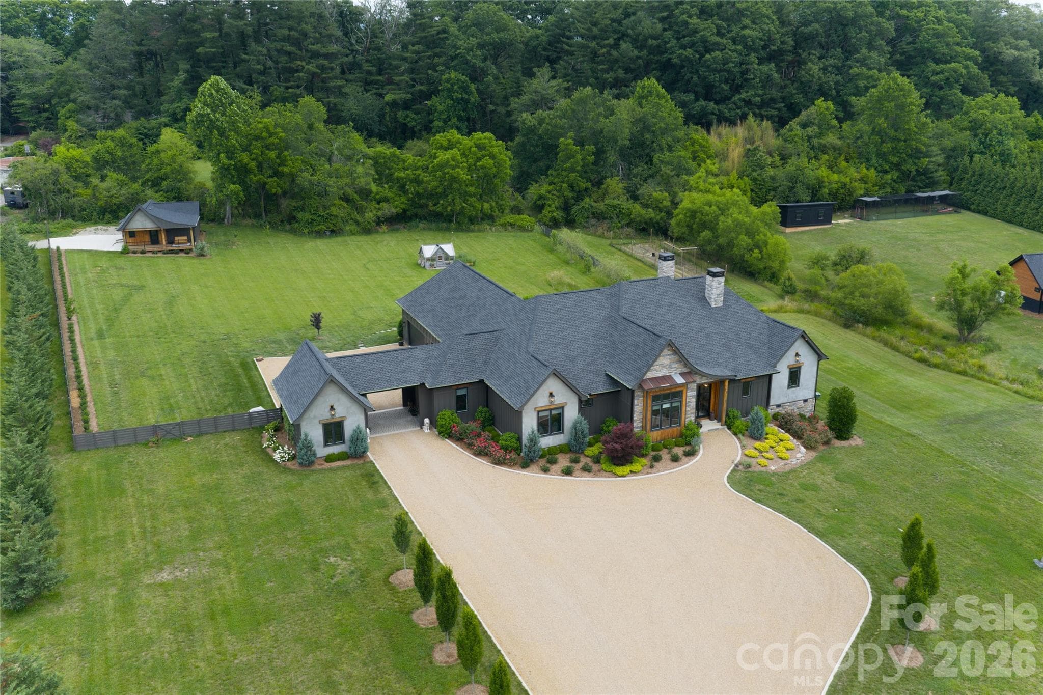 Elevated aerial view showcases the home's setting within the surrounding landscape. - 23 Benton Farms Lane, Horse Shoe
