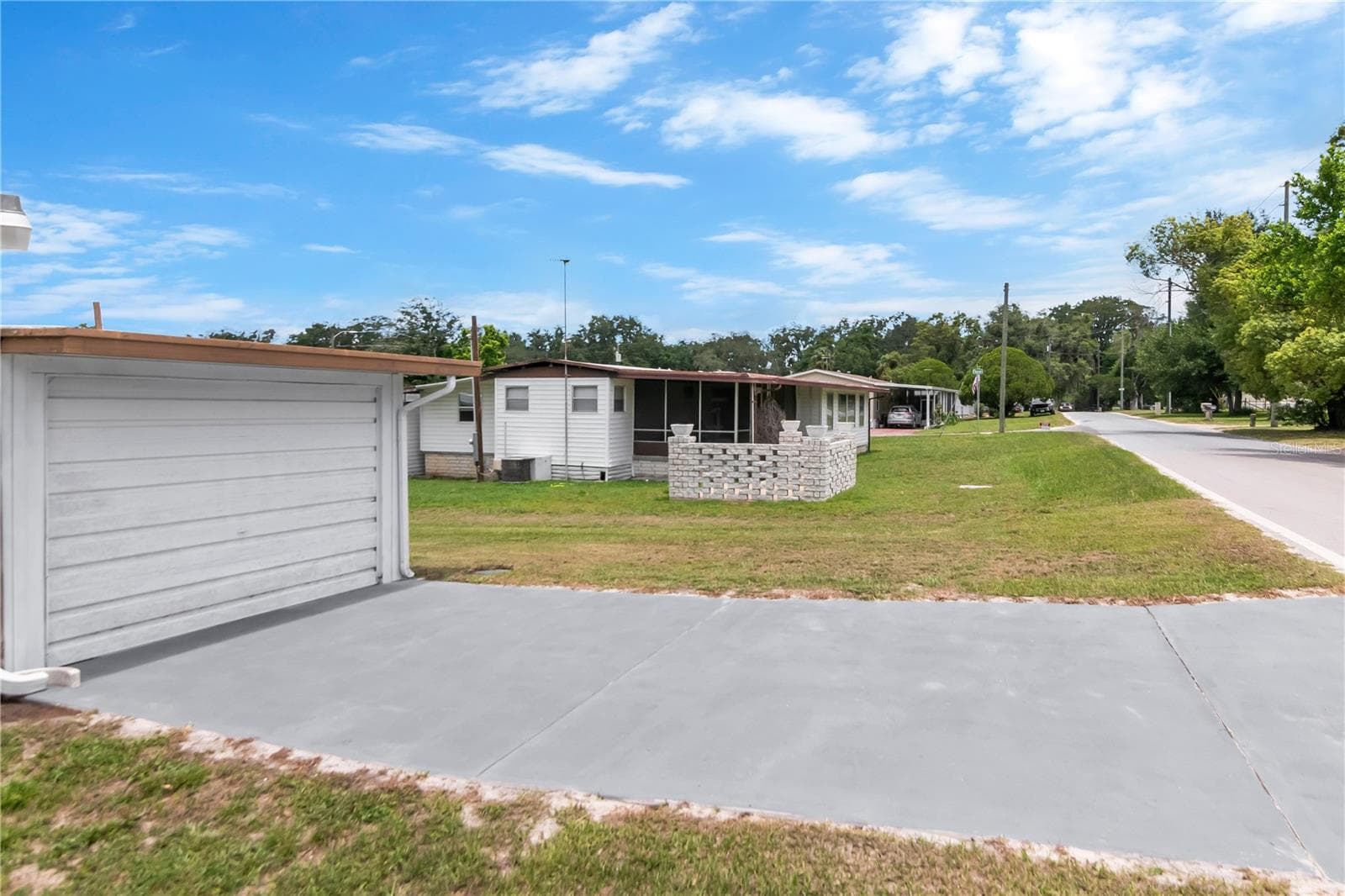 Manufactured Home at 39219 OLA AVE, ZEPHYRHILLS, photo 3 of 36