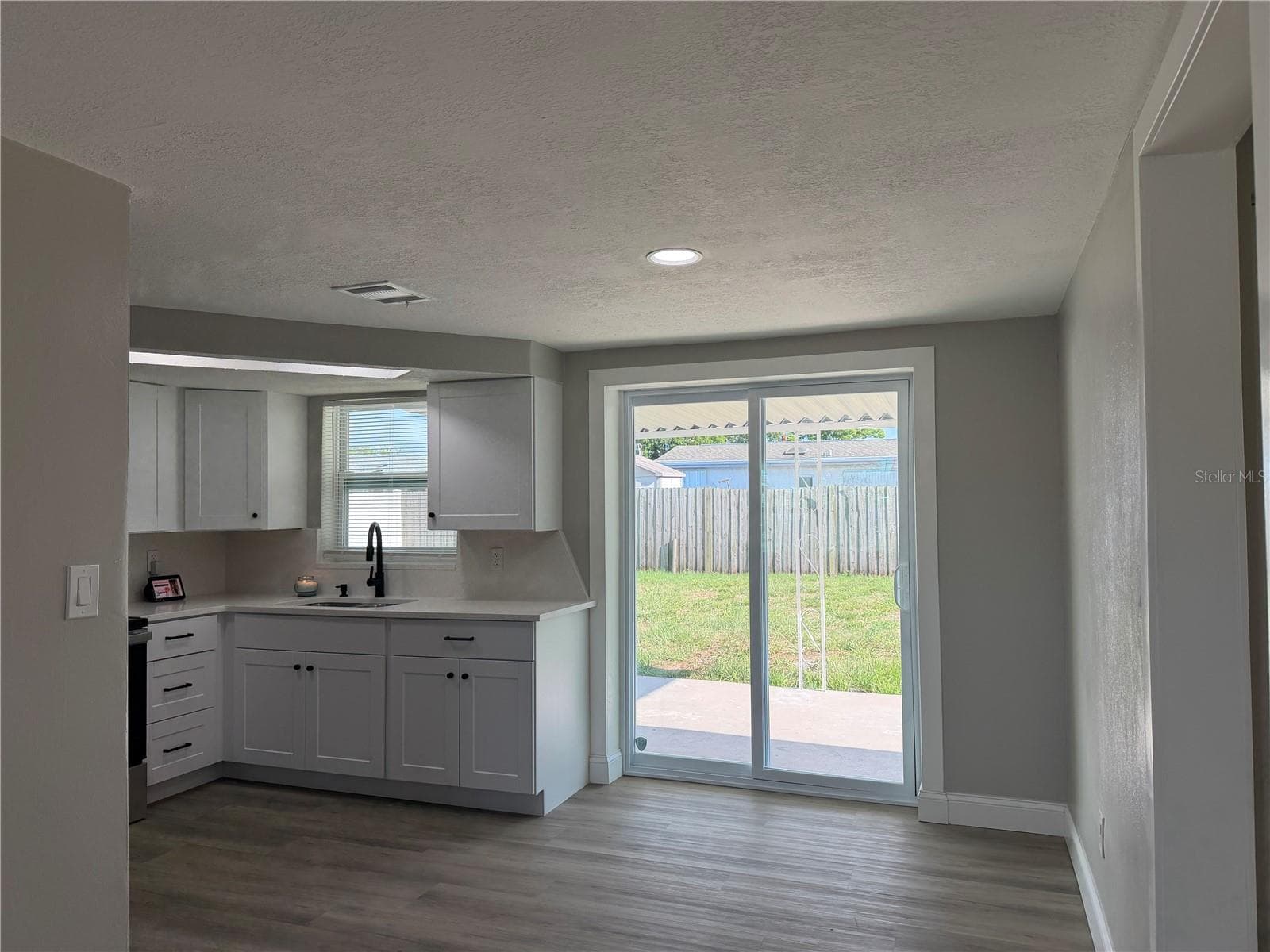 Kitchen and Dining Nook - 7220 FOX HOLLOW DR, PORT RICHEY