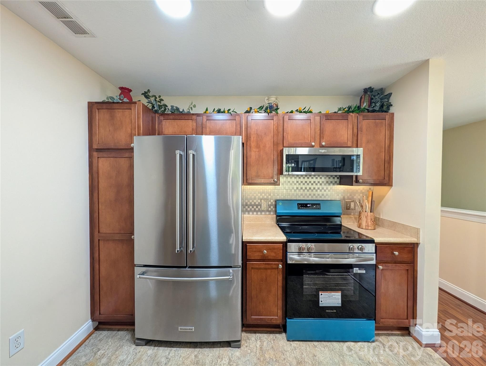 Fridge stays...blue wrap on new stainless stove - Fletcher