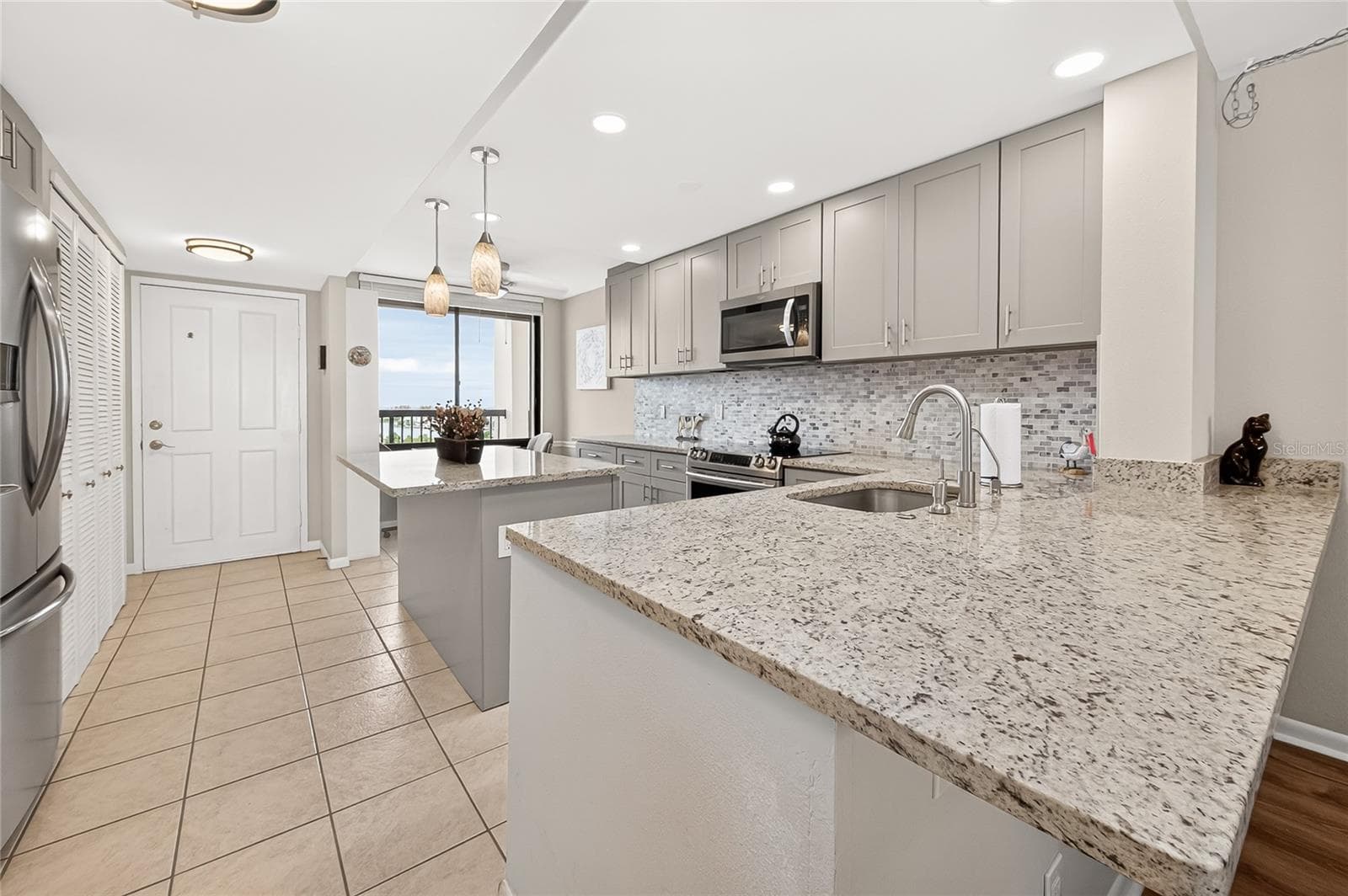 You can eat at the island, kitchen table or large breakfast bar - 9425 BLIND PASS RD #1103, ST PETE BEACH
