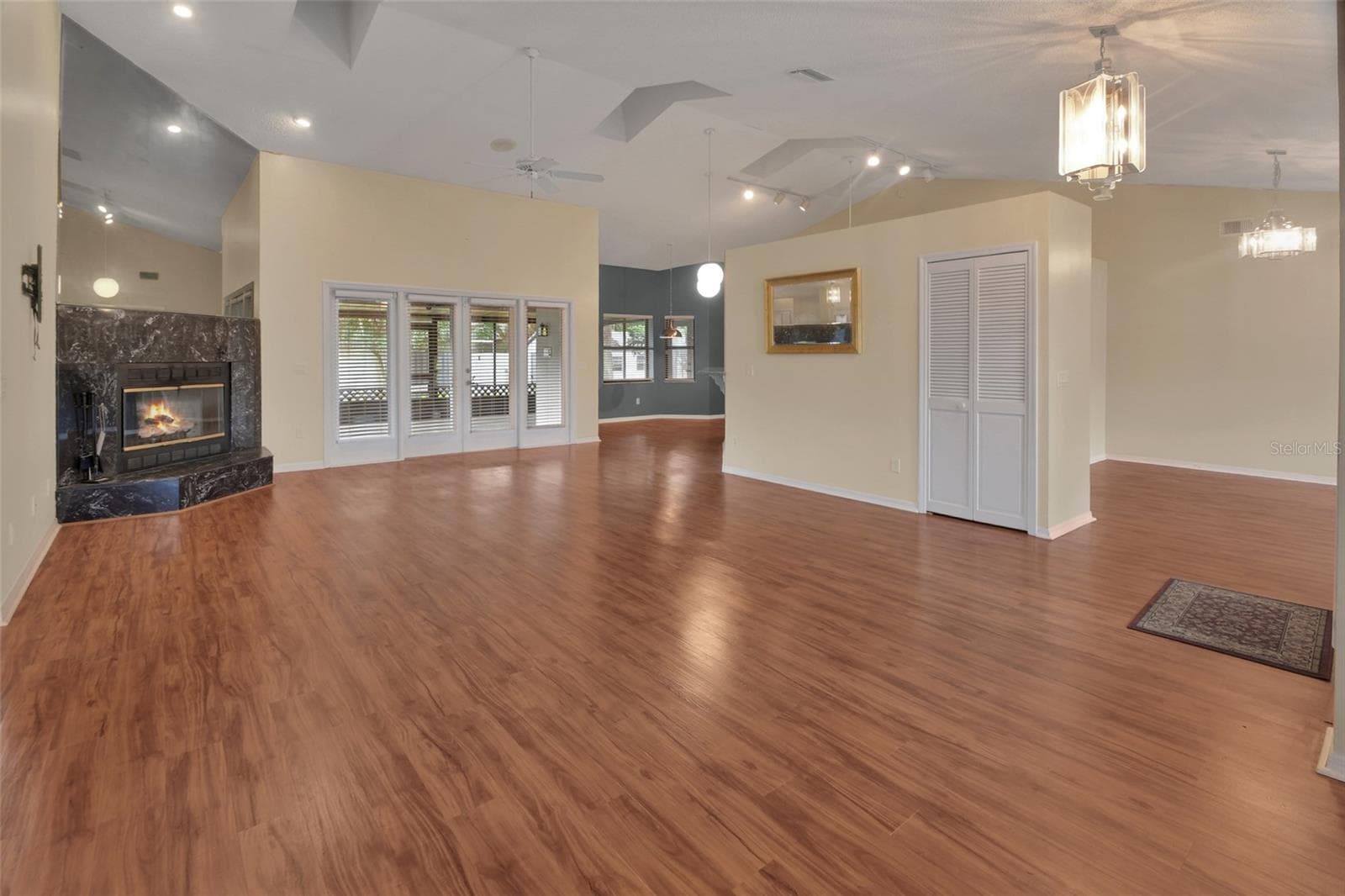 Living/Family Room to Kitchen. - 2465 ROYAL RD, DELAND