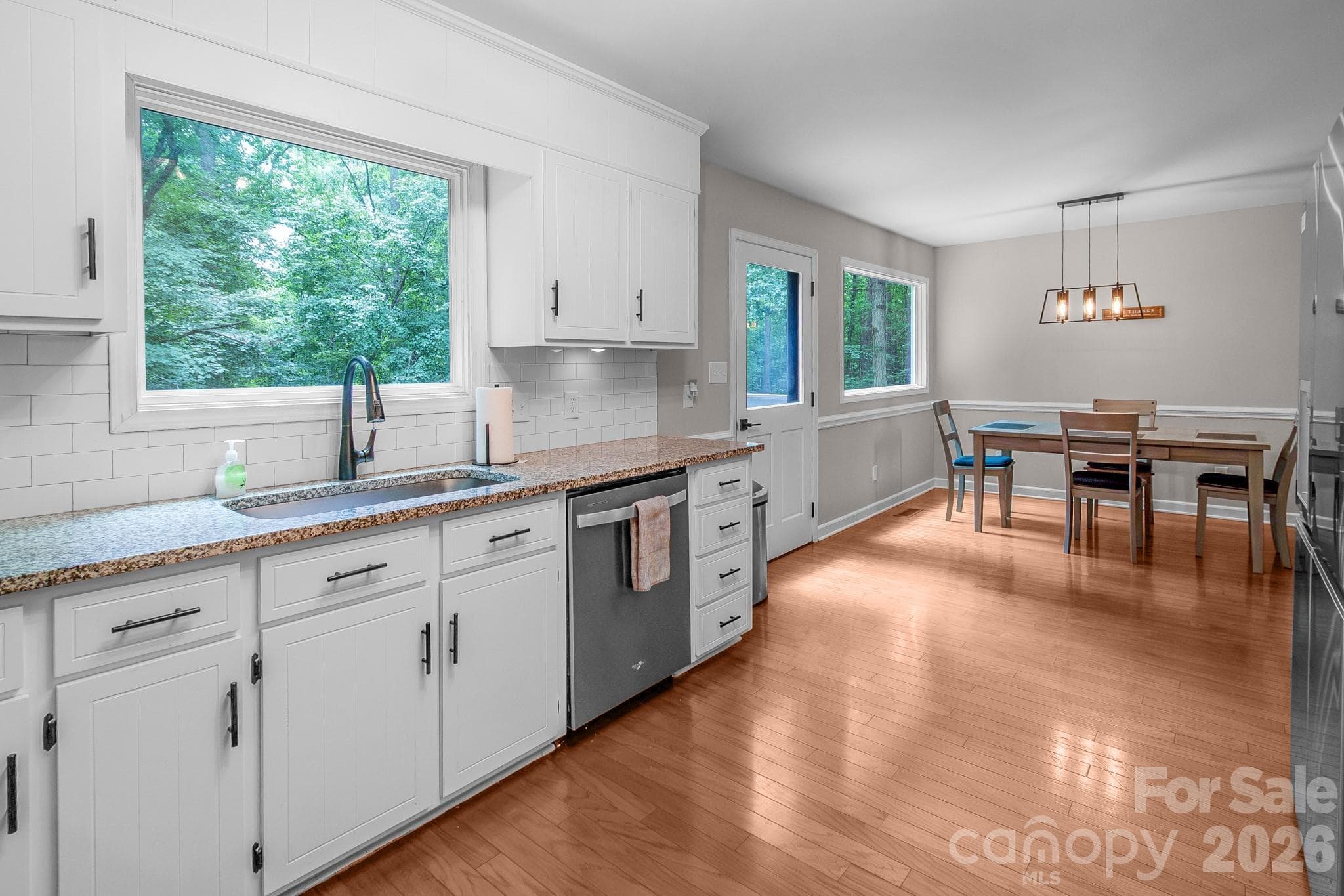 Modern kitchen updates with new windows and back door in 2022 - Waxhaw