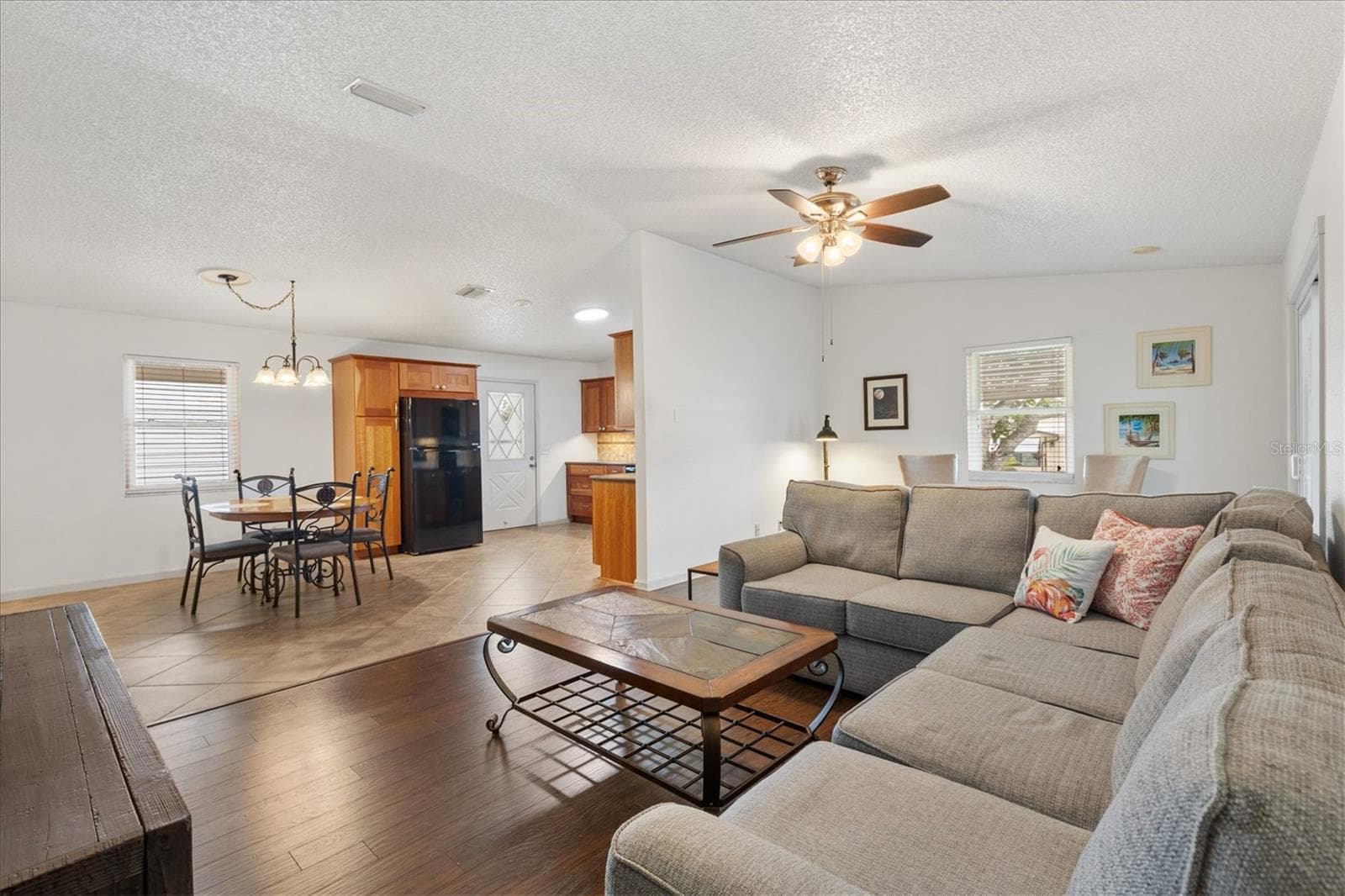 Living Room with view of Dining Room & Kitchen - 1534 HILLCREST DR, LADY LAKE