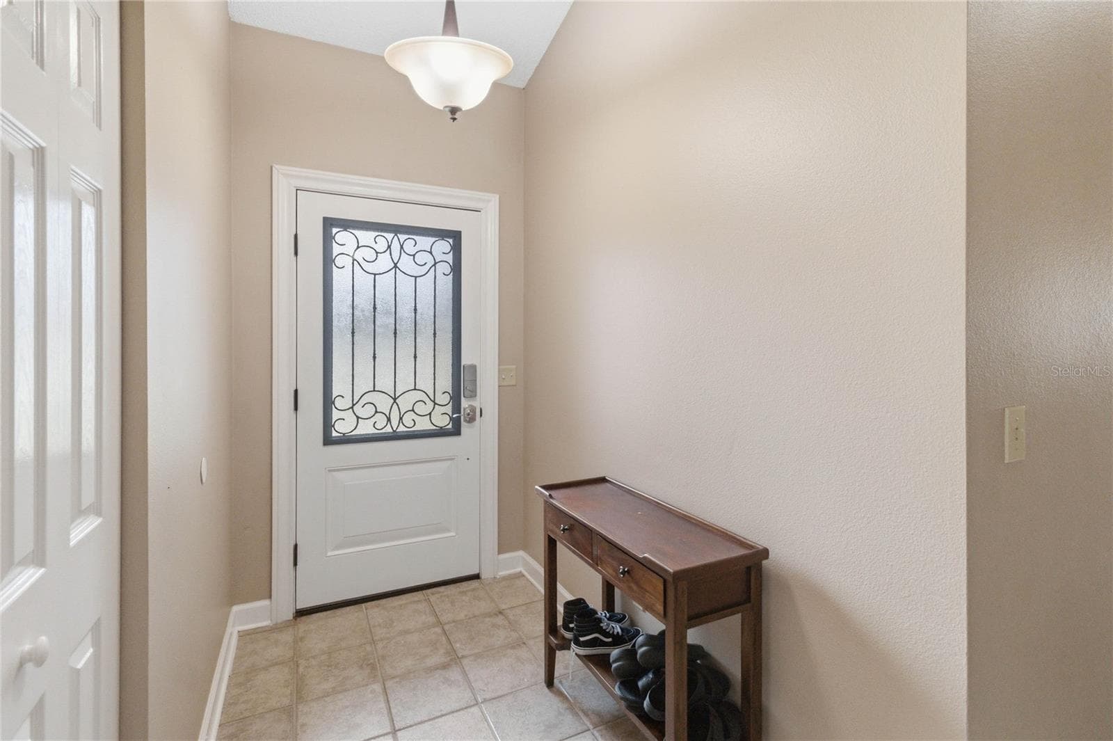 Foyer includes a coat closet - 1564 CYPRESS WOODS CIR, ST CLOUD
