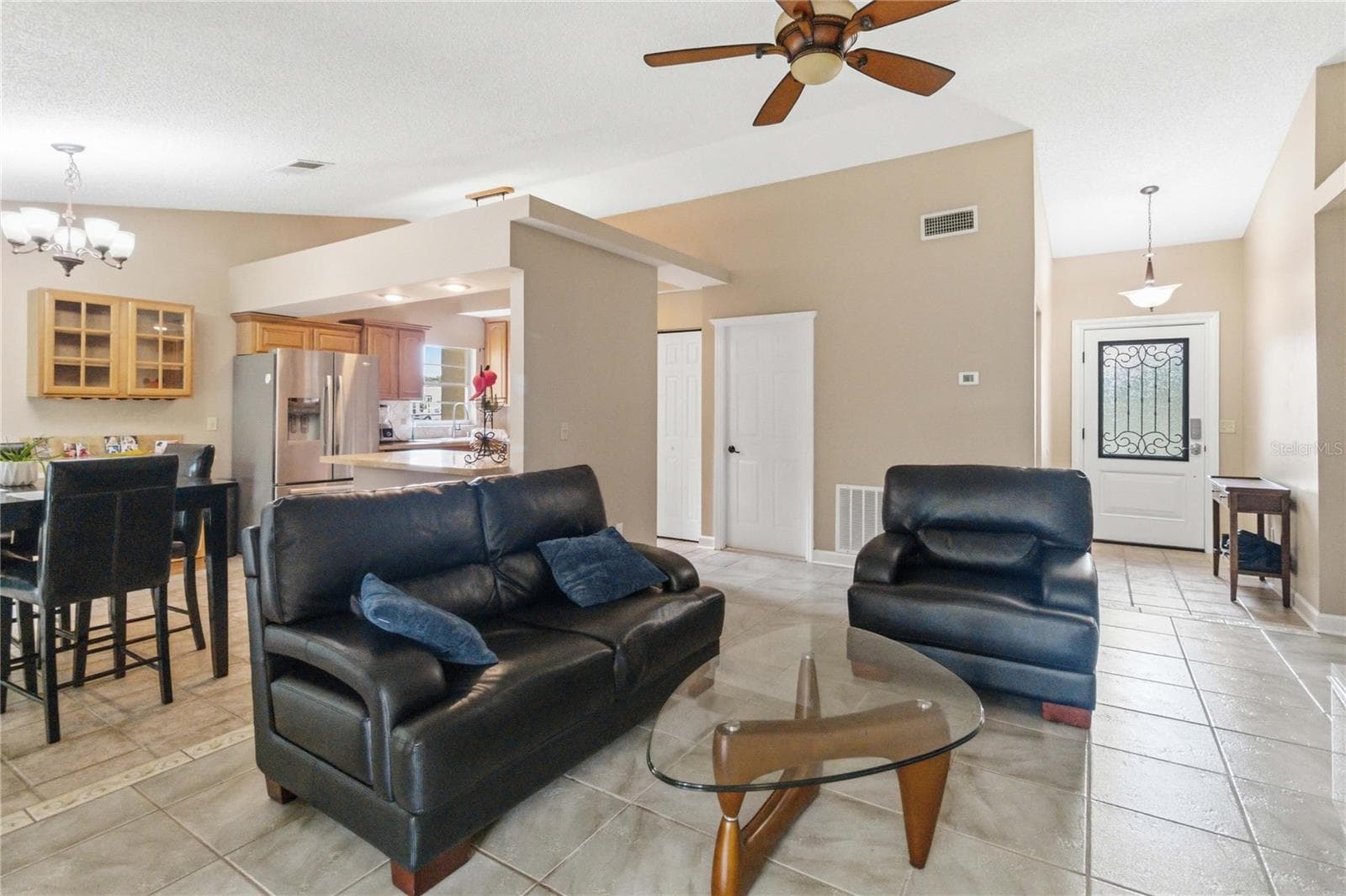 Kitchen flows nicely to dining and living areas - 1564 CYPRESS WOODS CIR, ST CLOUD